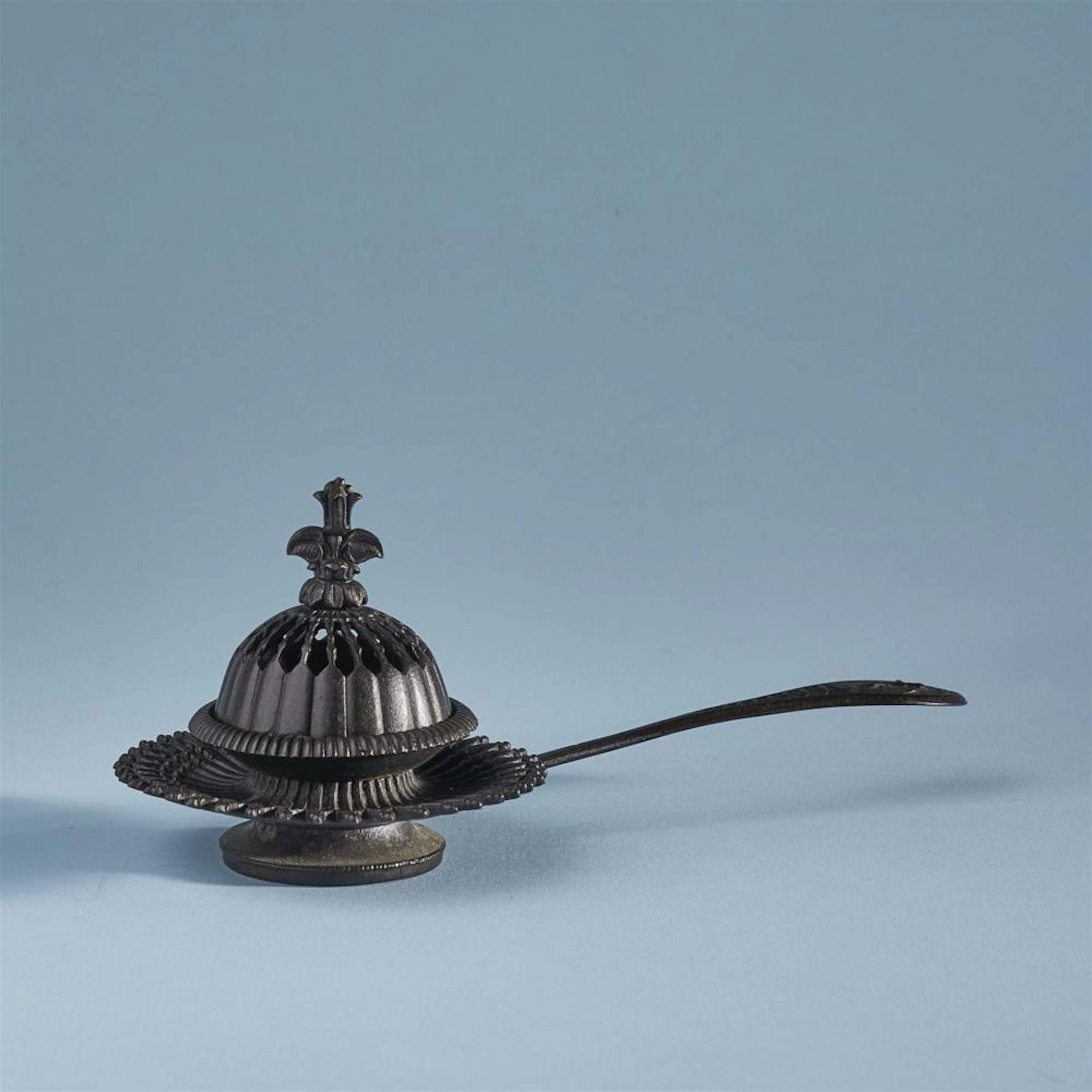 A cast iron incense burner