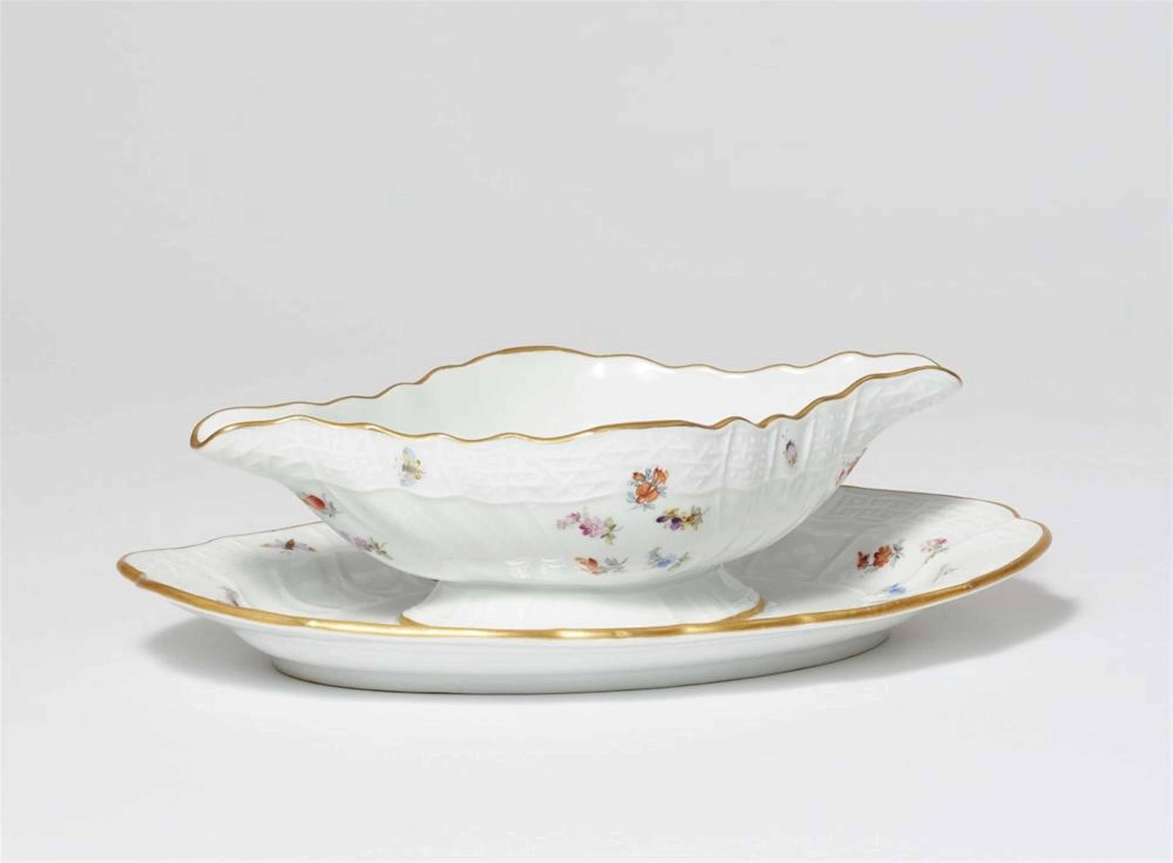 A Meissen porcelain sauce boat from a dinner service for Wilhelm II