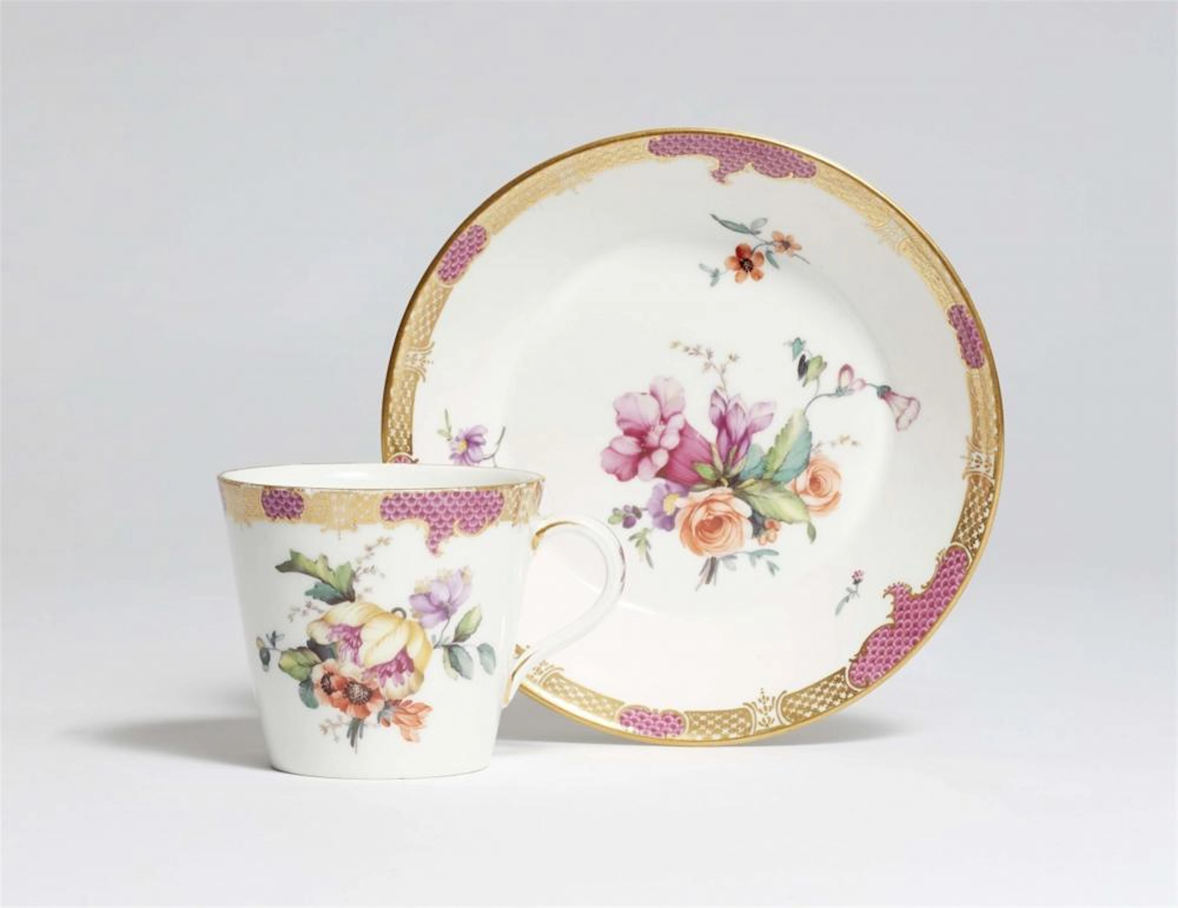 A Berlin KPM porcelain cup and saucer with floral decoration