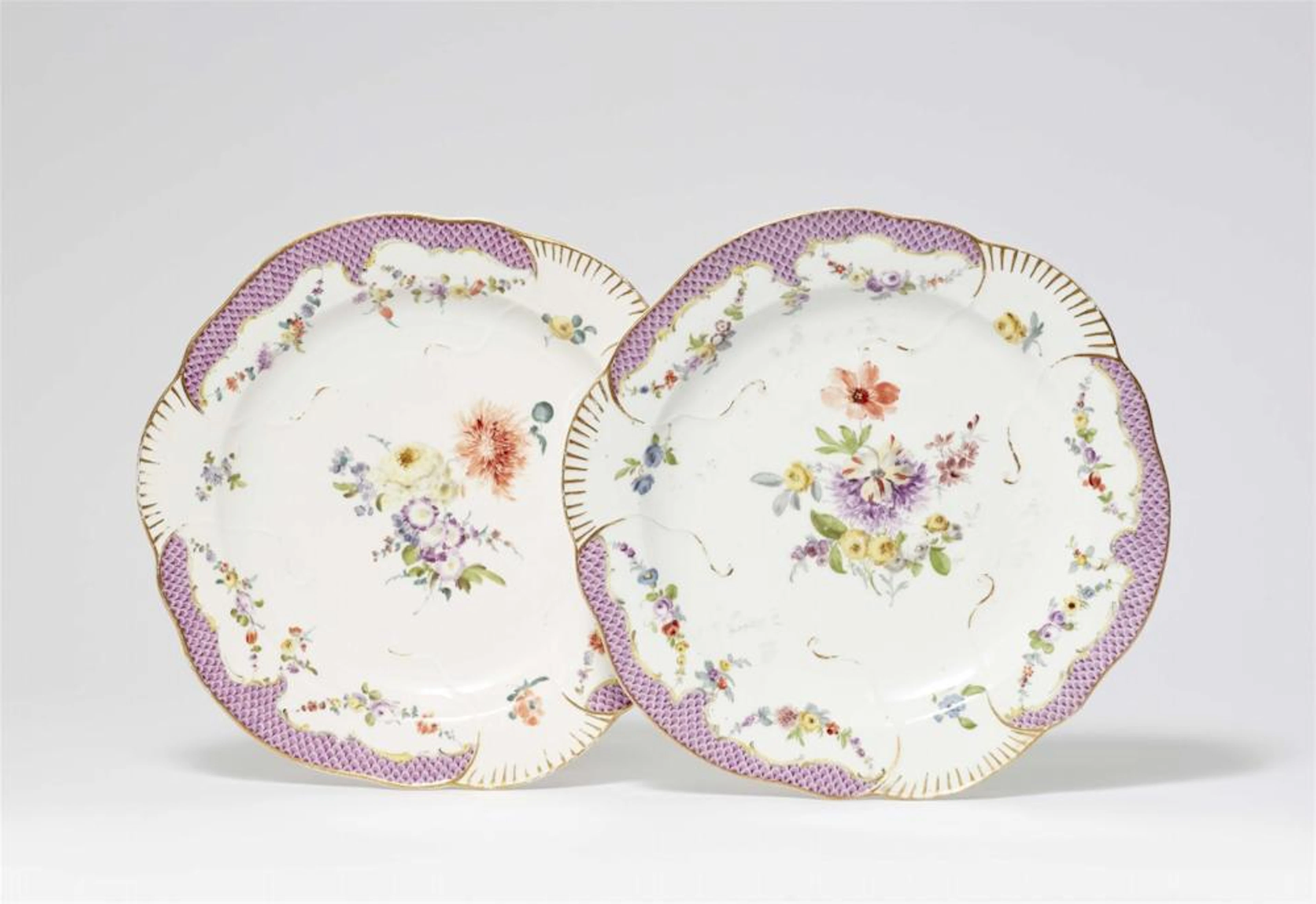A pair of Meissen porcelain dinner plates from the "Schwerin Service"