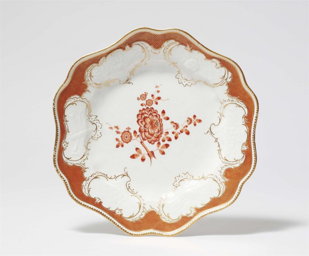 A Meissen porcelain dinner plate from the dinner service with the iron red mosaic border