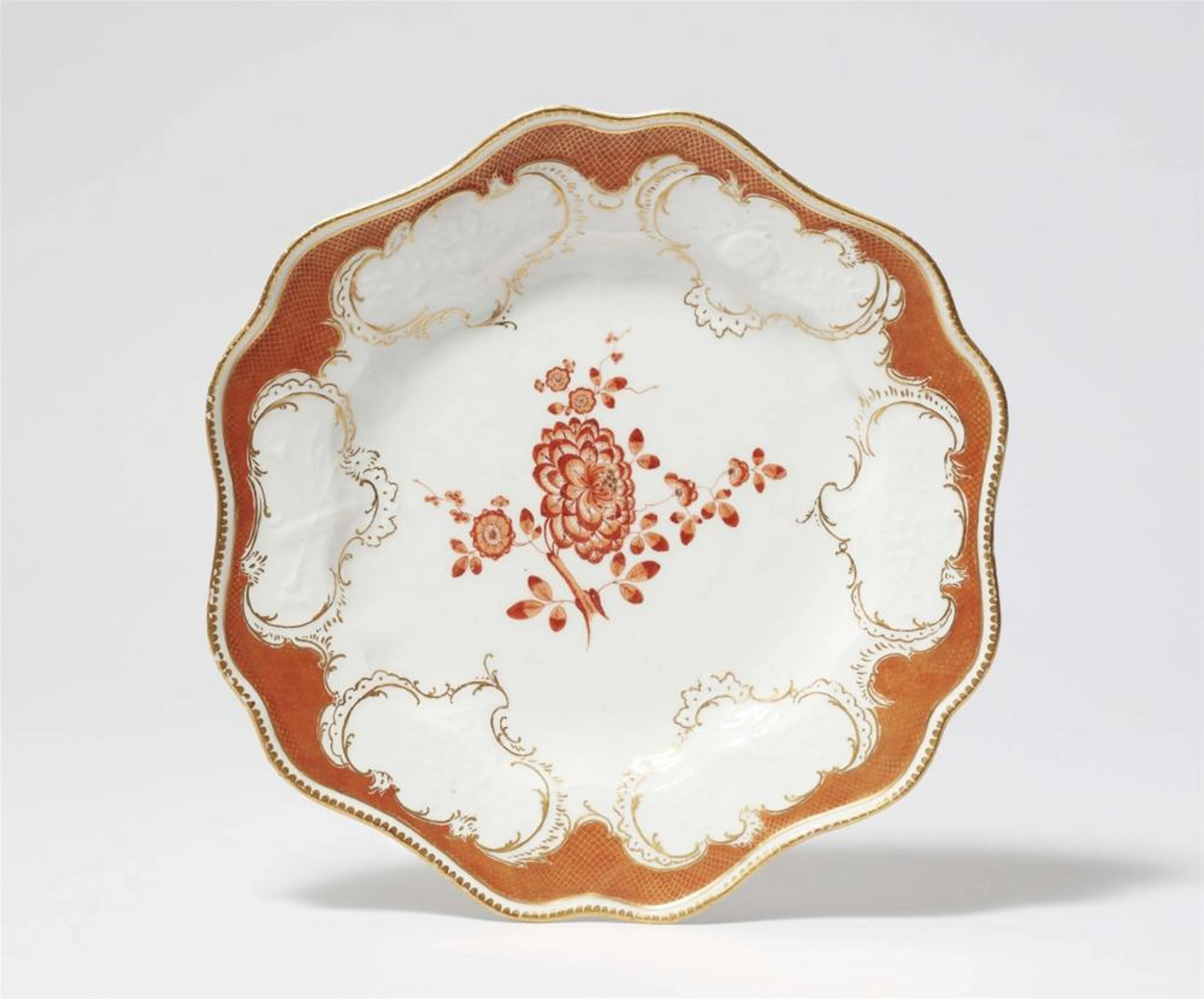 A Meissen porcelain dinner plate from the dinner service with the iron red mosaic border
