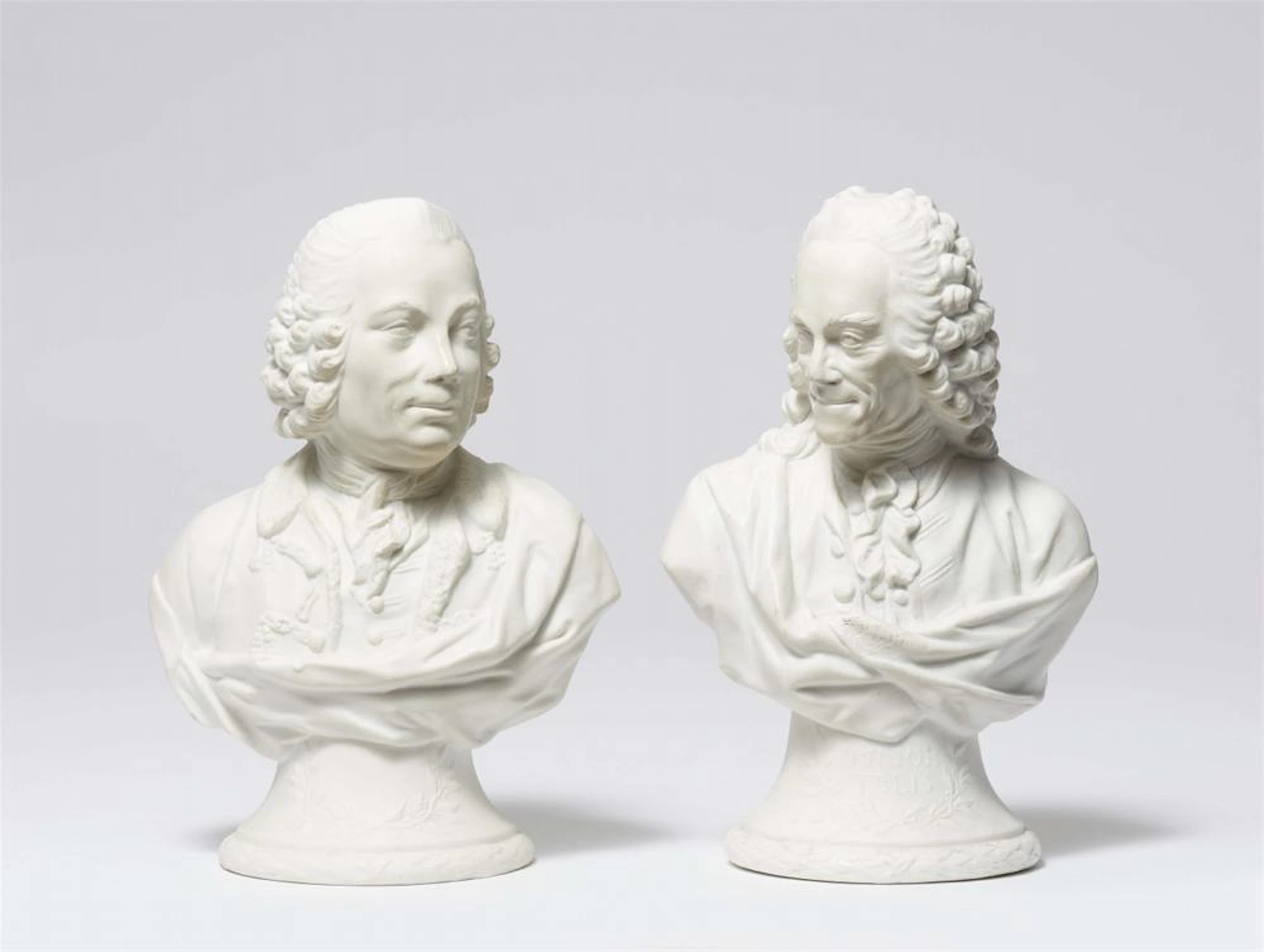 Two Berlin KPM biscuit porcelain busts of Voltaire and Marquis d'Argens