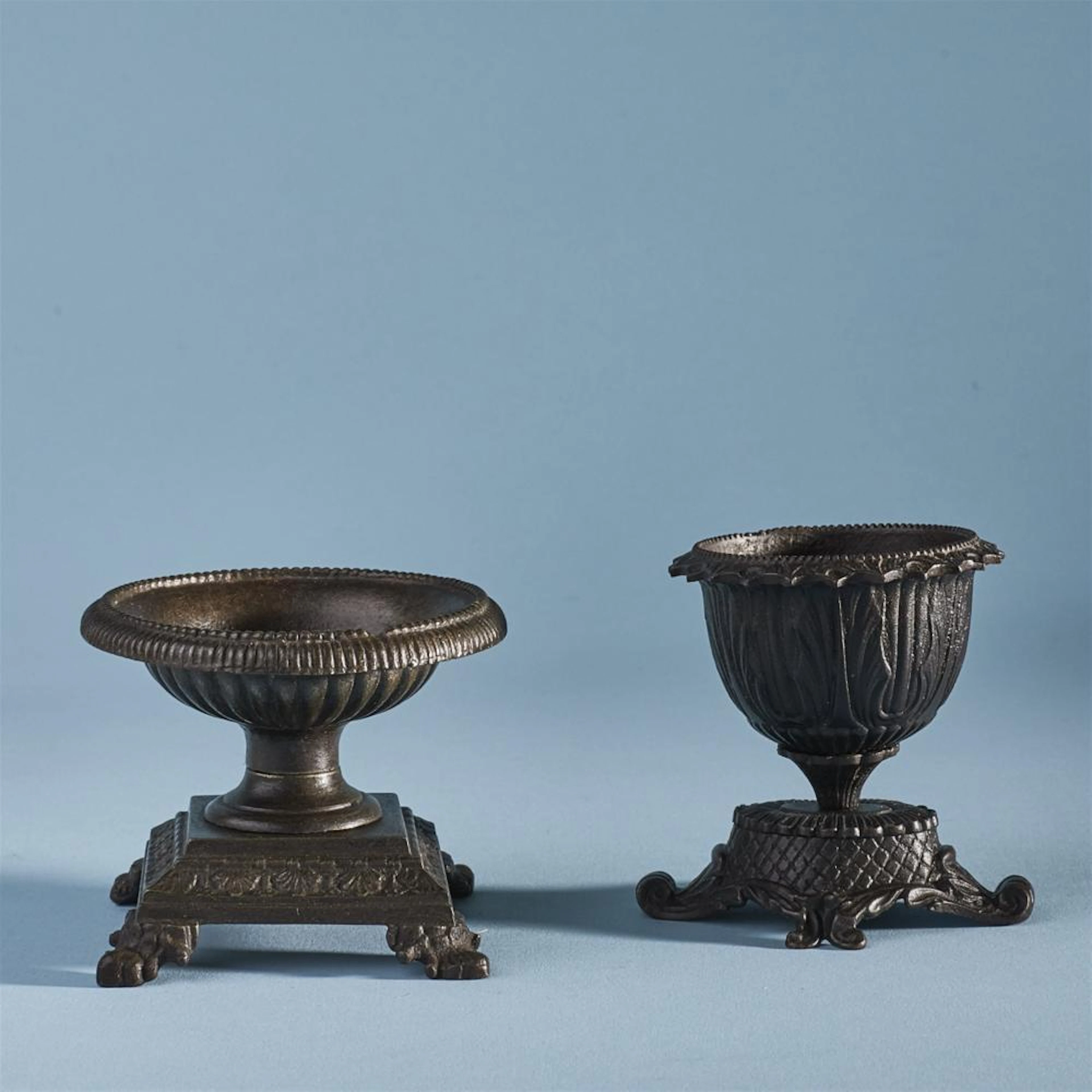 Two small cast iron dishes
