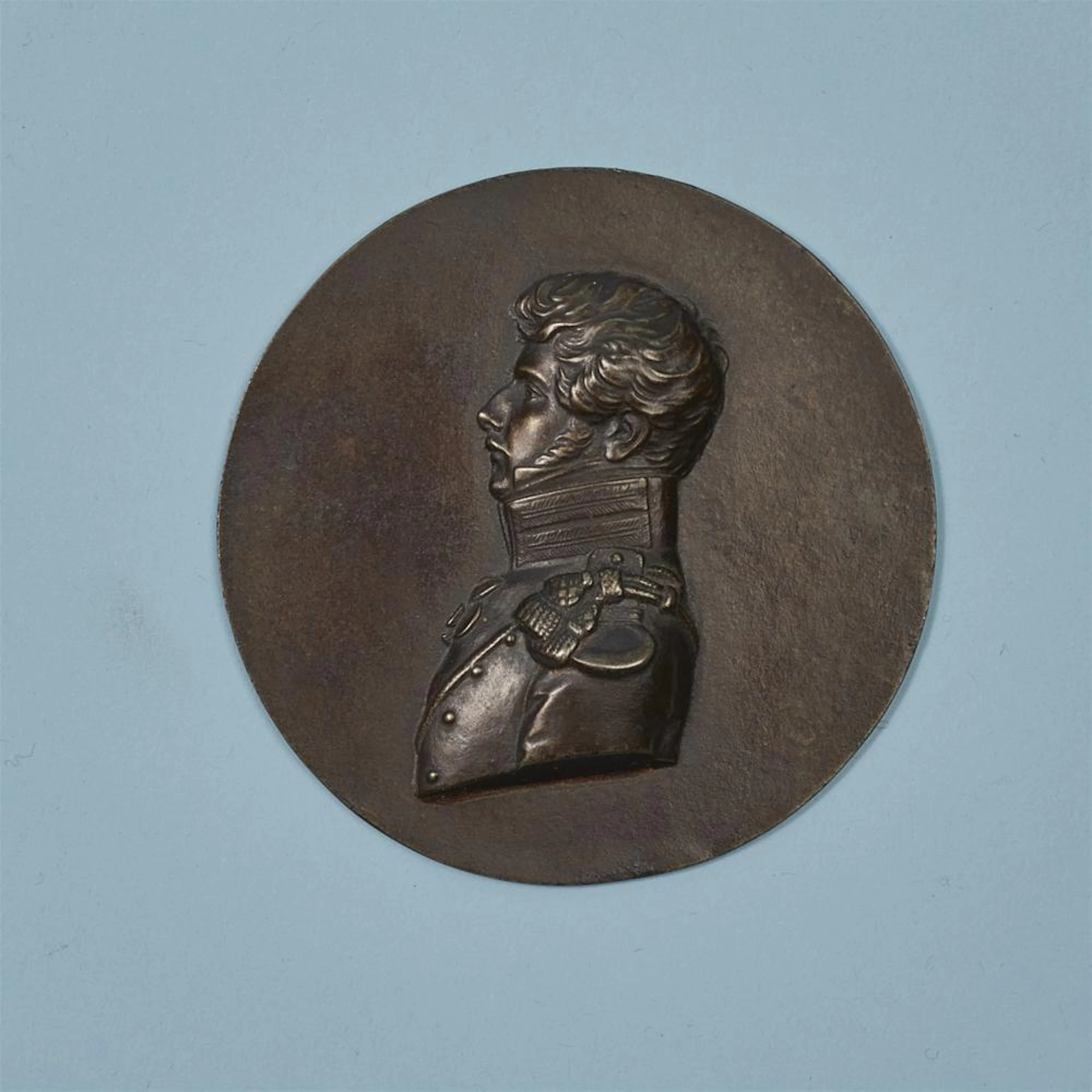 A round cast iron plaque with a portrait of Prince Friedrich Wilhelm Ferdinand Radziwill