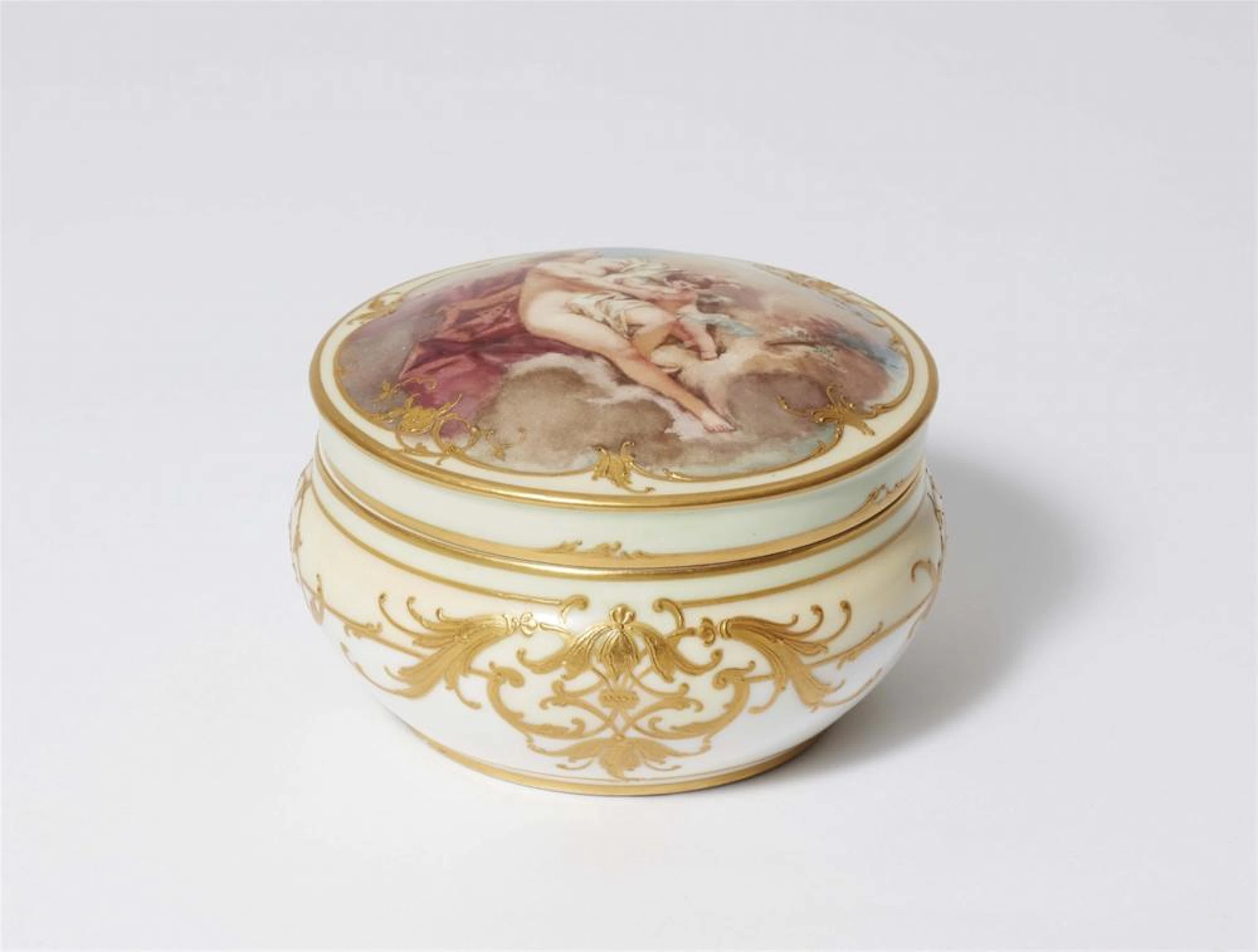 A Berlin KPM porcelain bonbonnière with Venus and Cupid