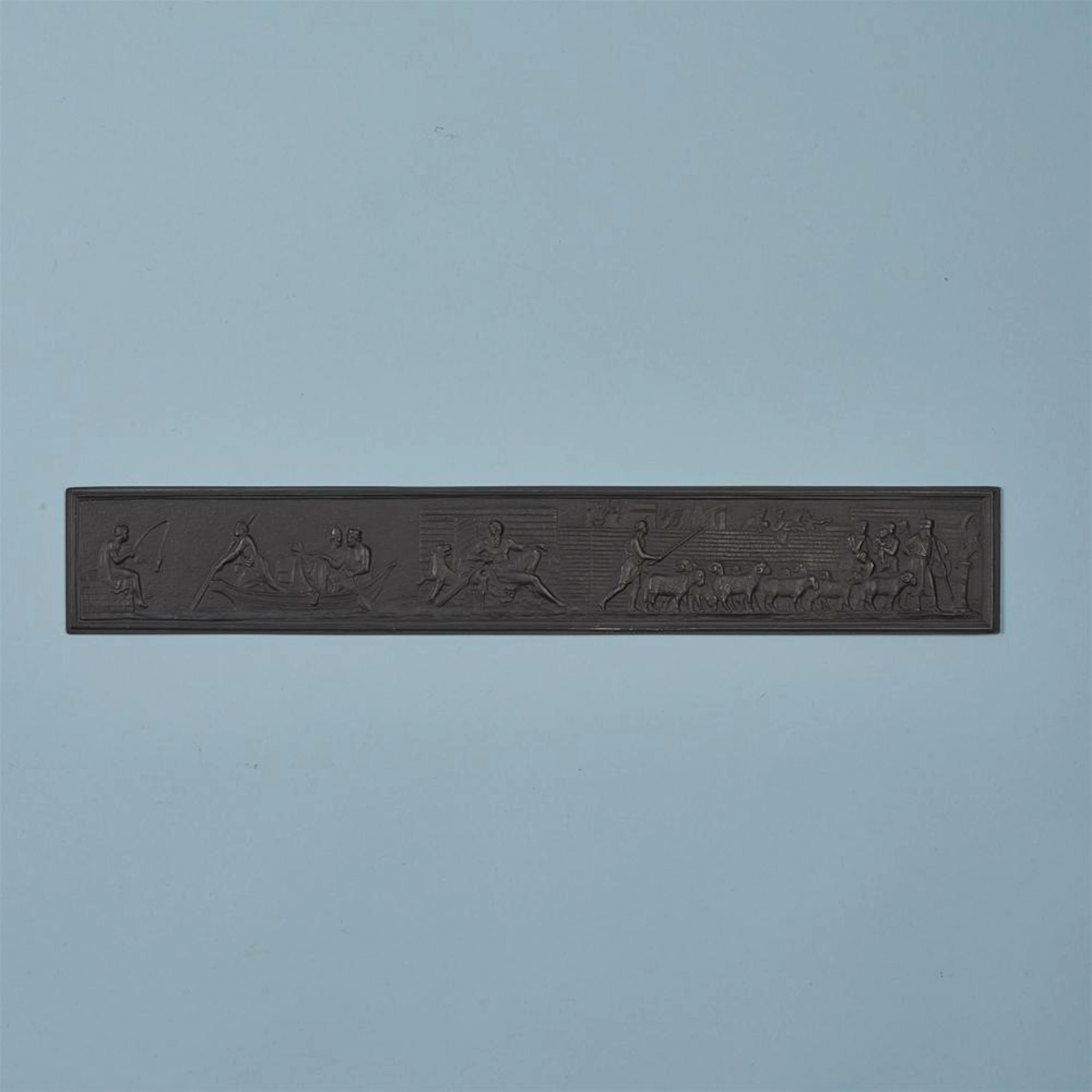 A rare cast iron ruler with the triumph of Alexander the Great