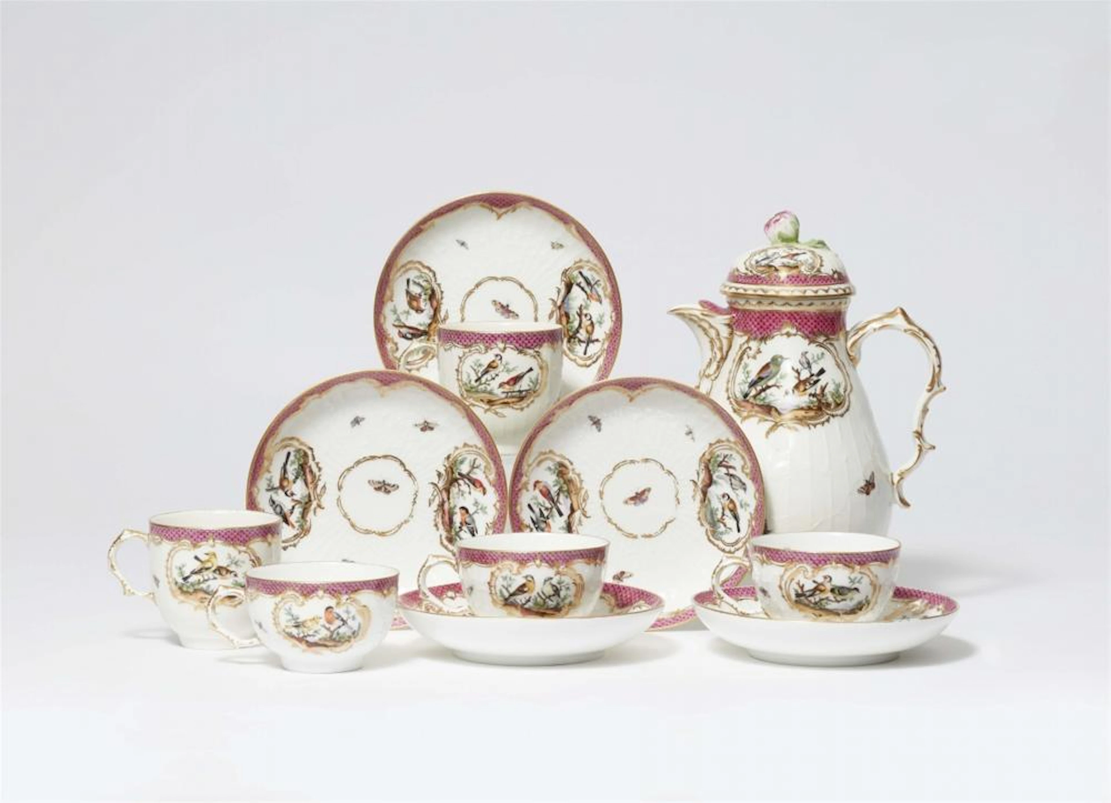 Several items of Berlin KPM porcelain from a service with bird decoration