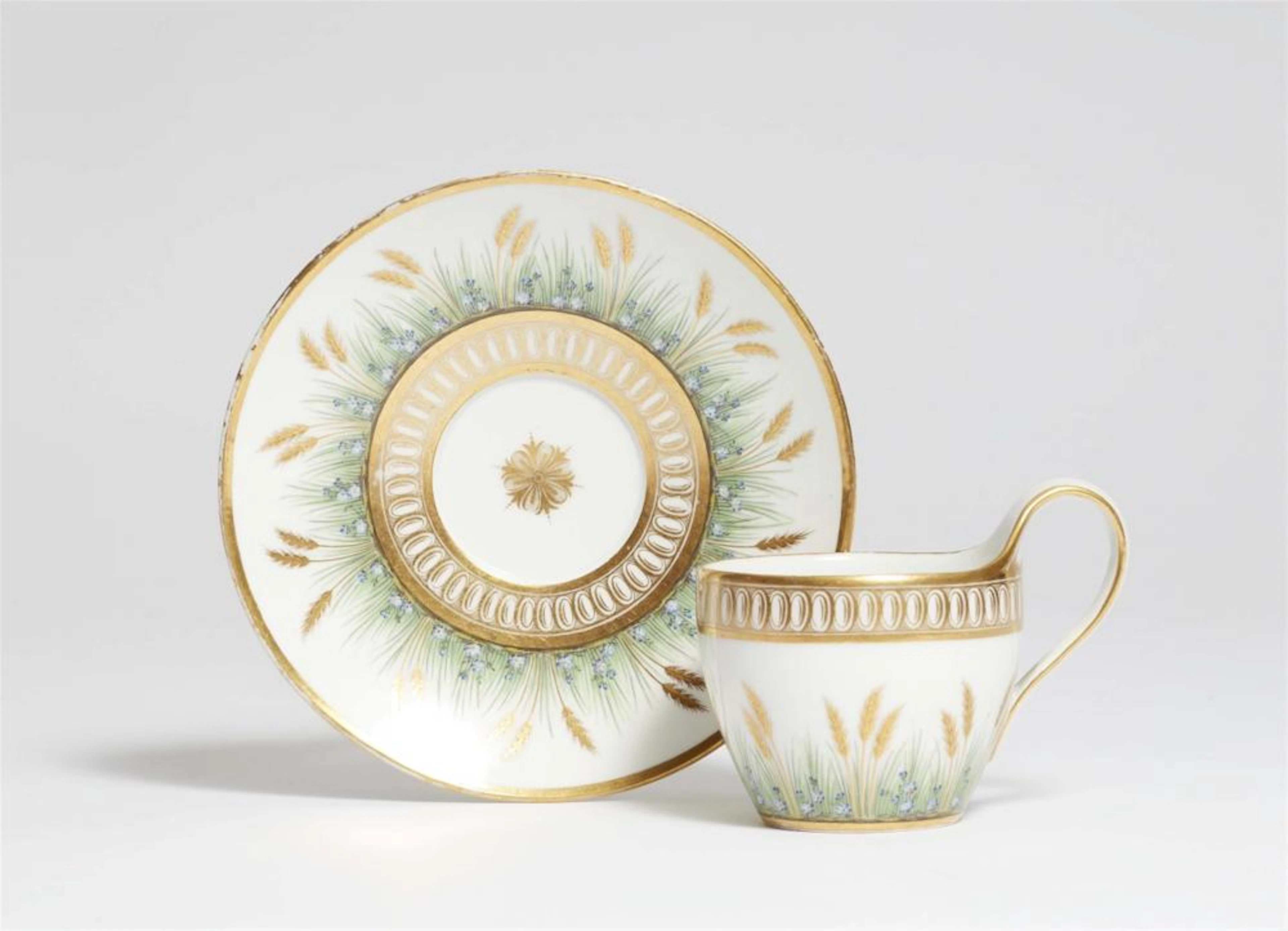 A Berlin KPM porcelain cup with golden wheat motifs