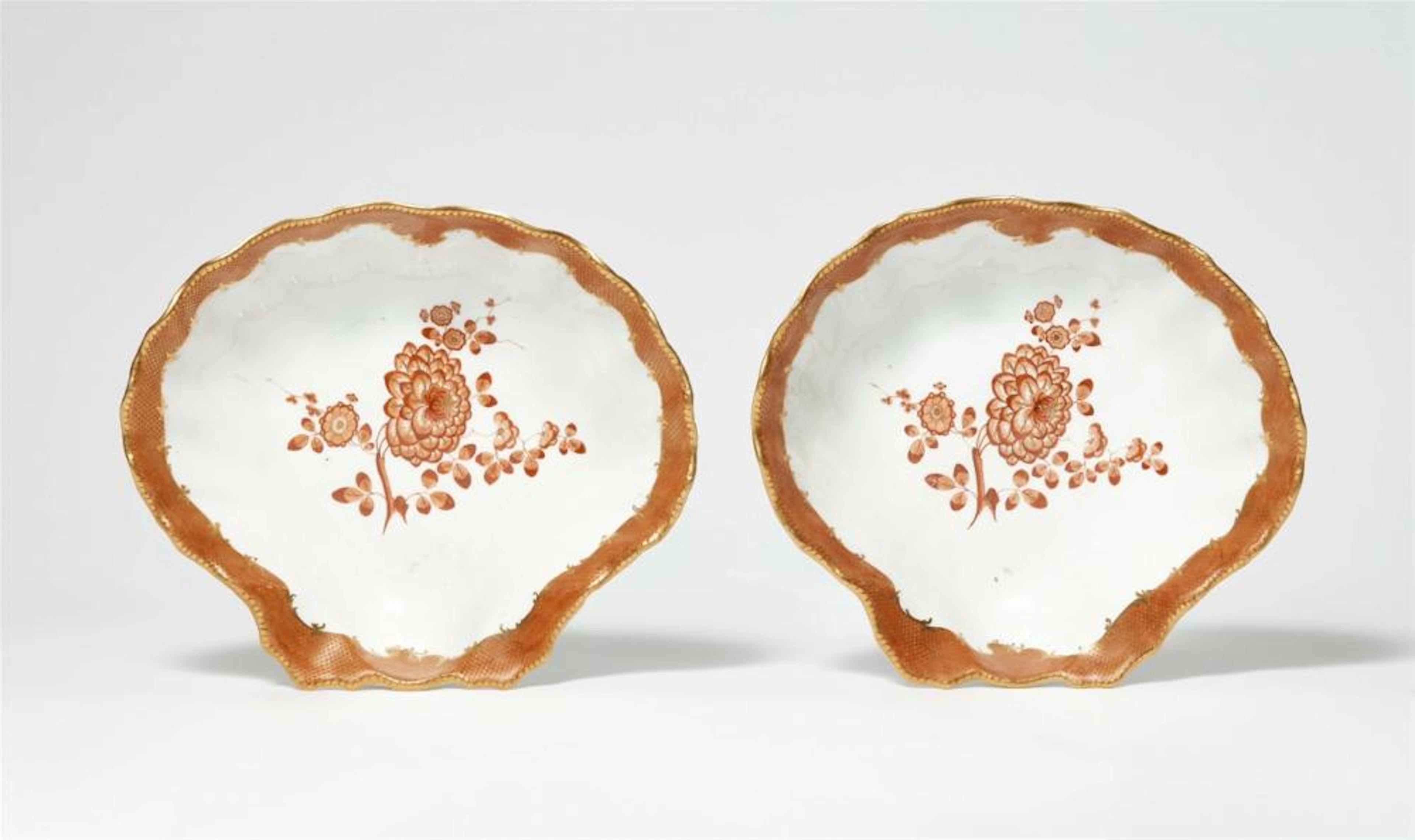 A pair of Meissen porcelain shell dishes from the dinner service with the iron red mosaic borders