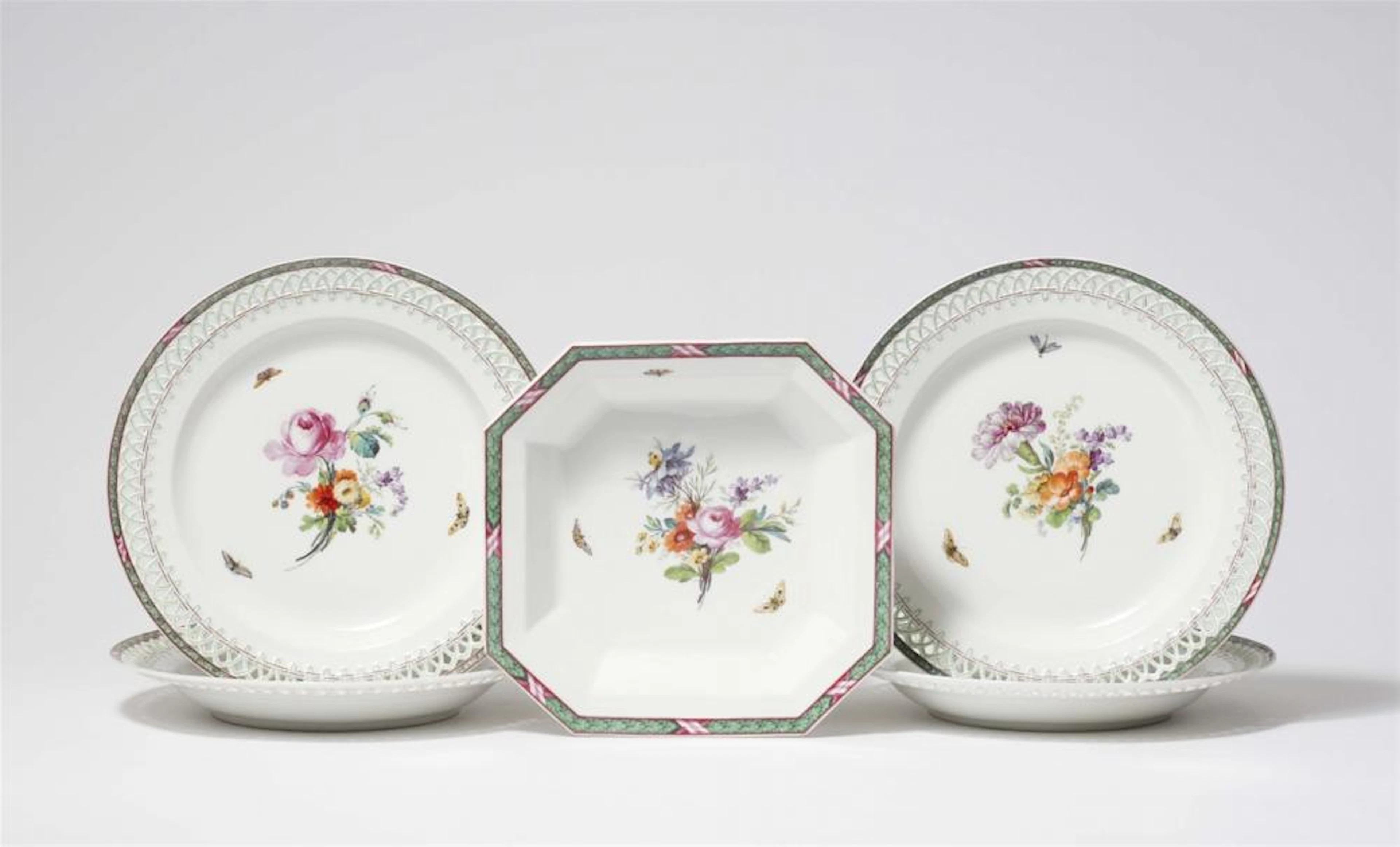 Four Berlin KPM porcelain dessert plates and a compote dish with oak leaf decor