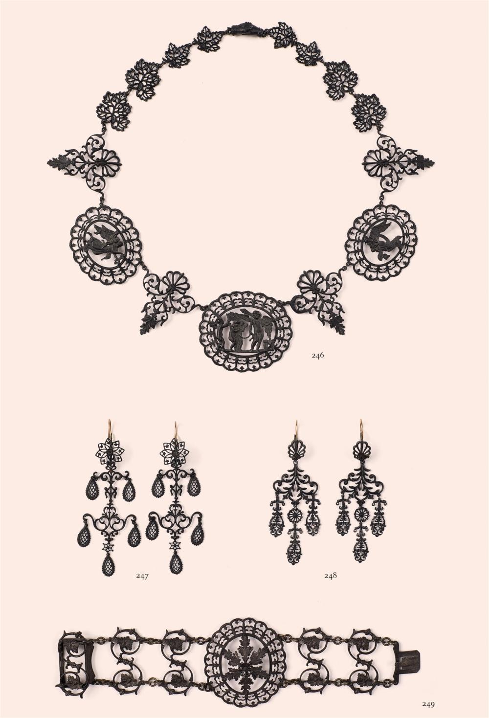 A pair of cast iron pendant earrings
