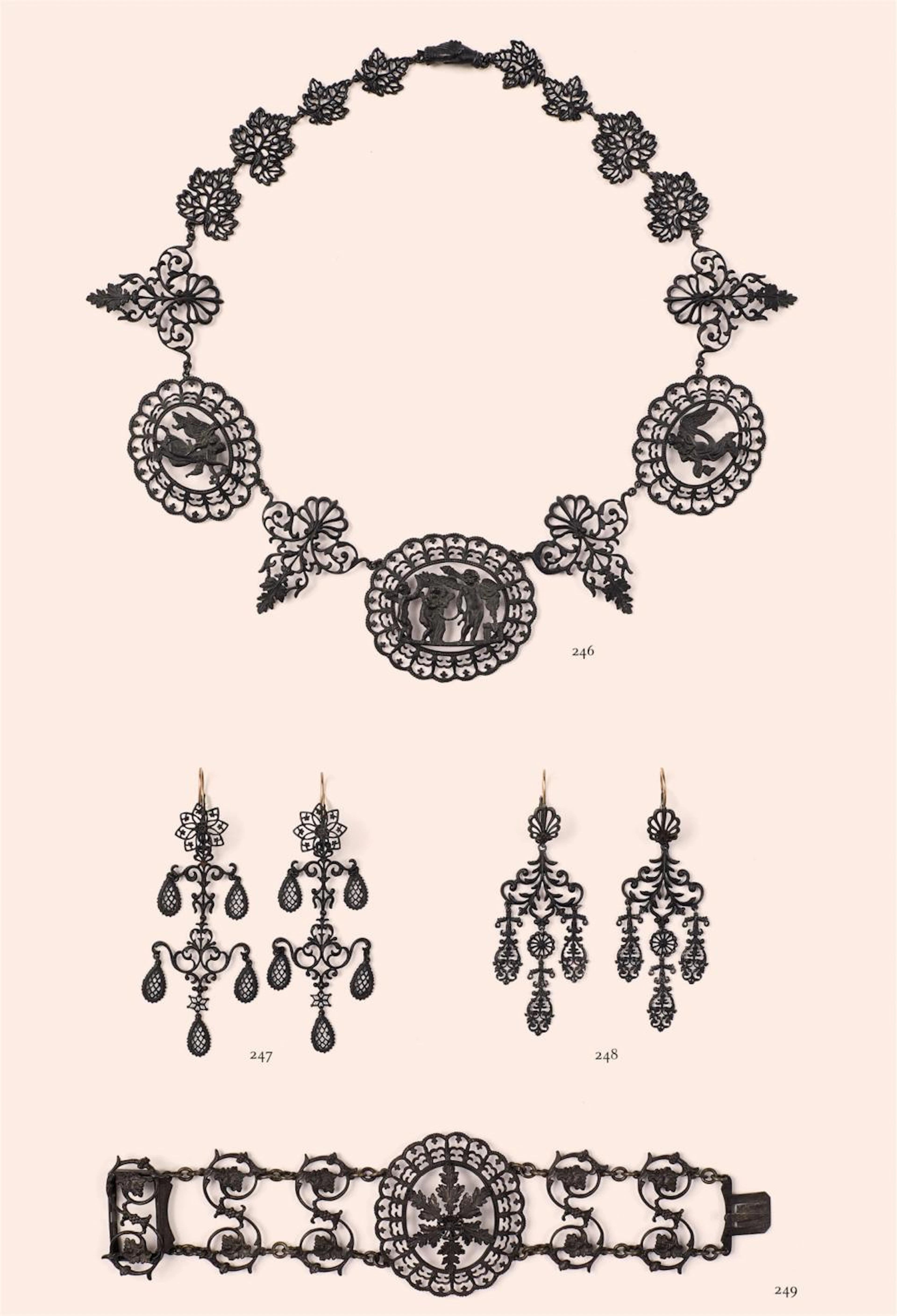 A pair of cast iron pendant earrings