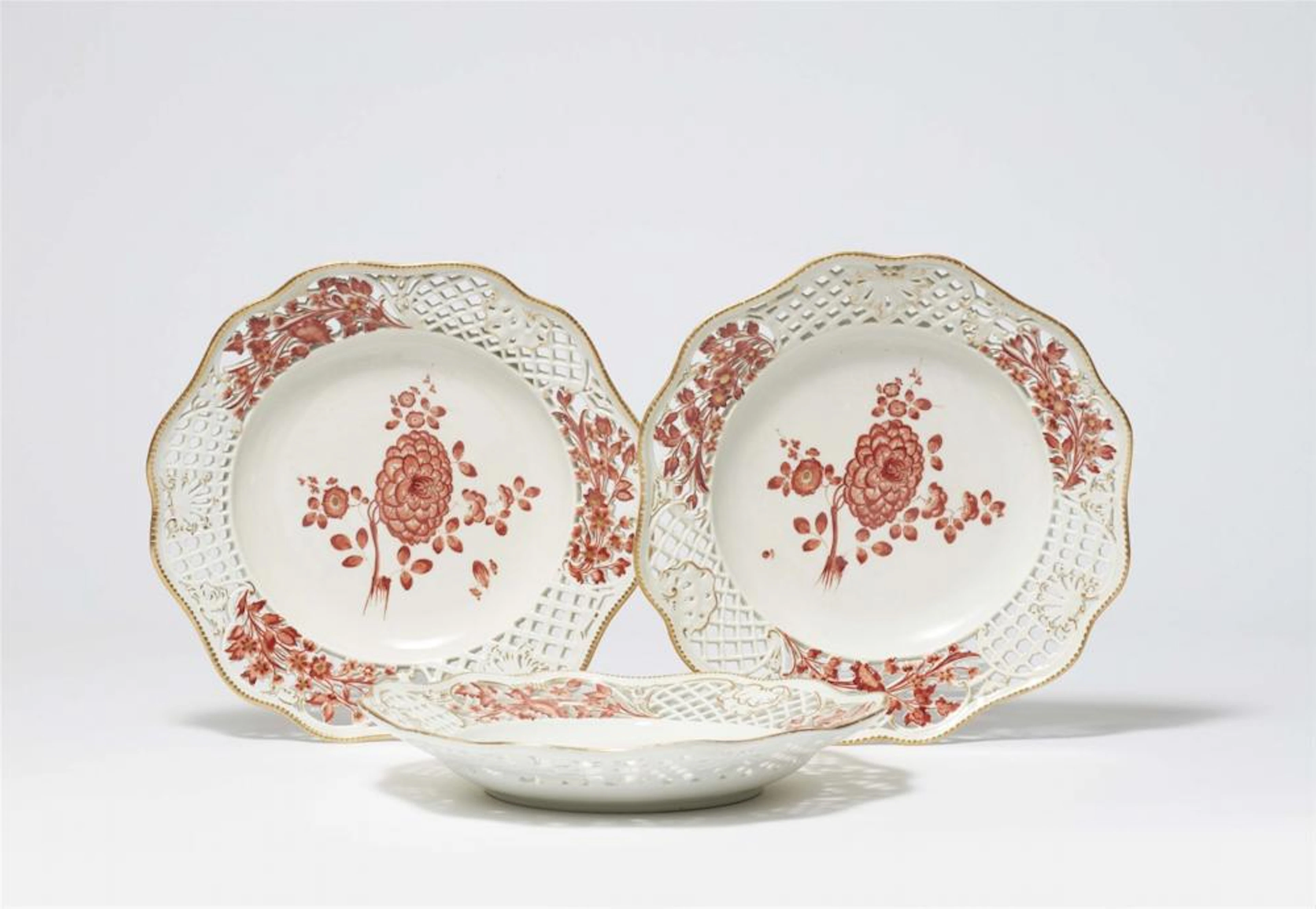 Three Meissen porcelain dessert plates from the service with red mosaic pattern borders