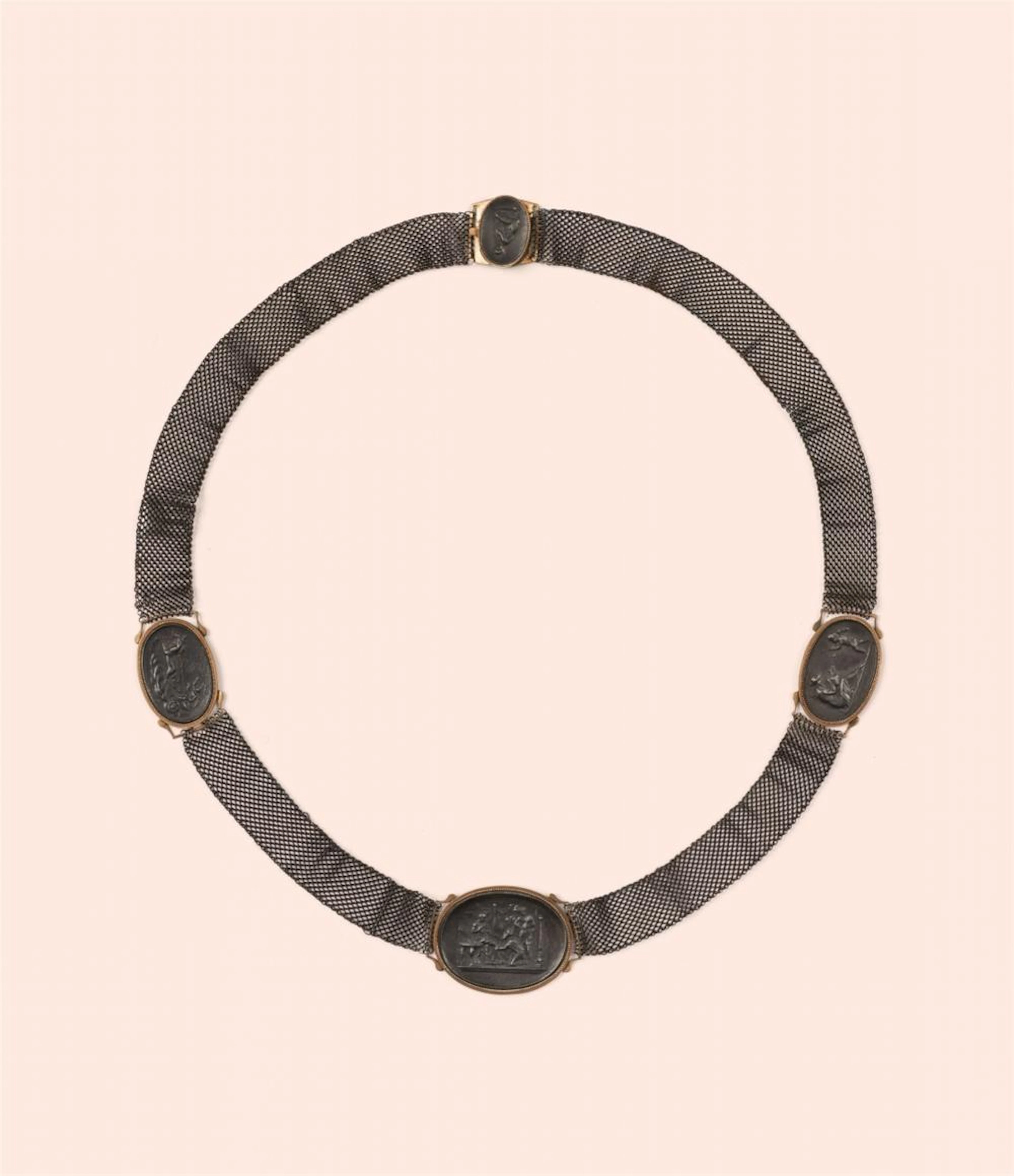 A woven cast iron necklace with cameos