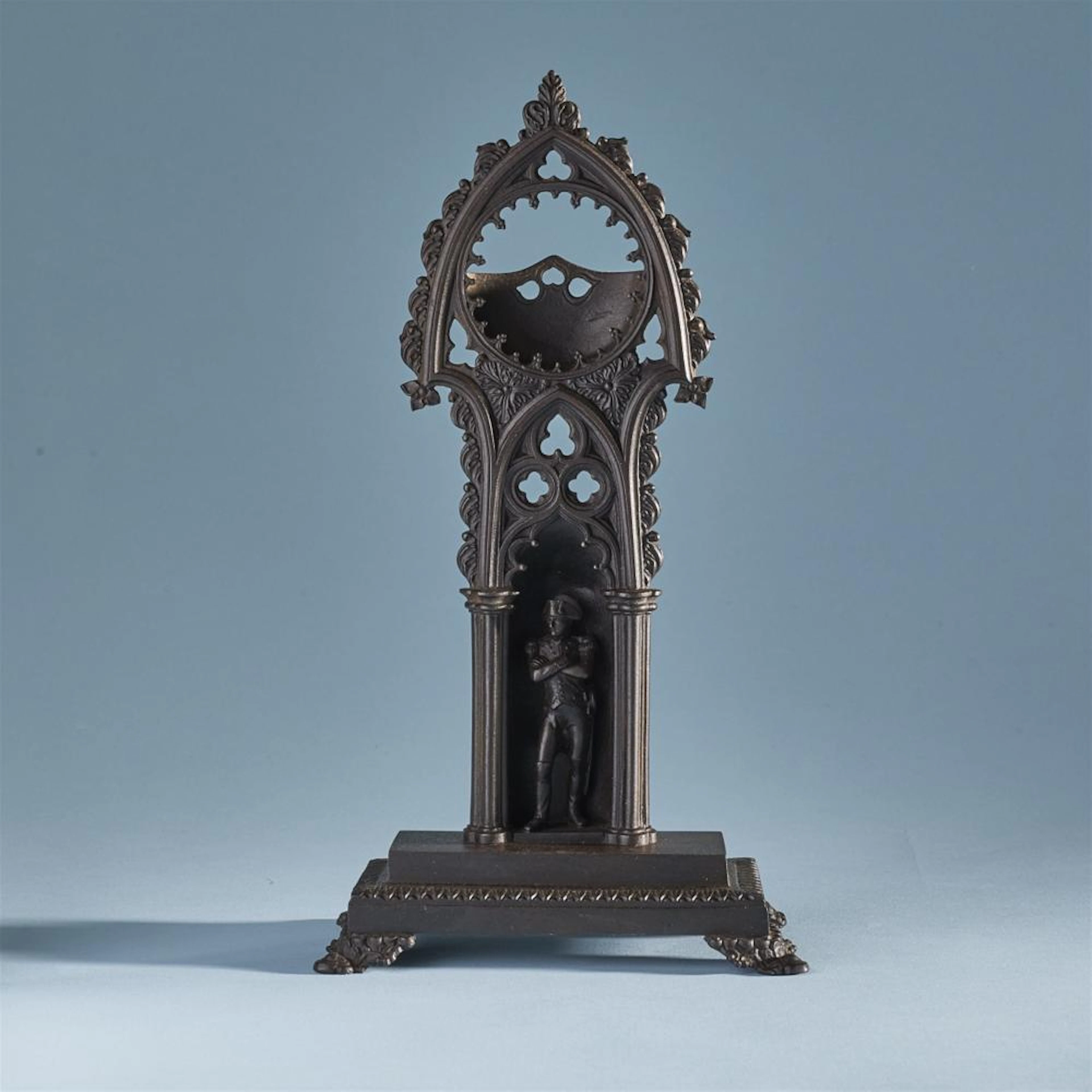 A rare cast iron porte montre with Napoleon