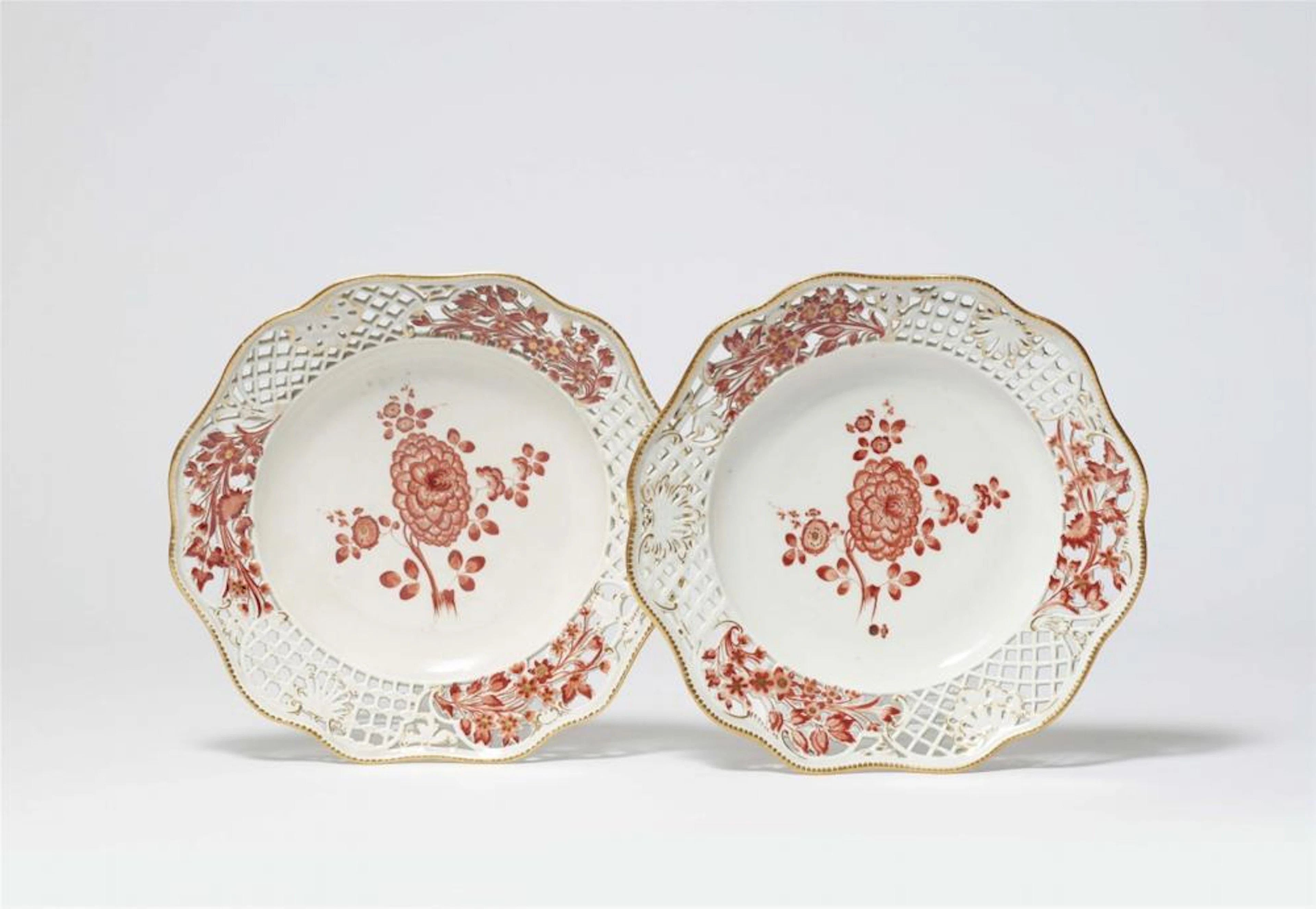 Two Meissen porcelain dessert plates from the dinner service with the iron red mosaic border