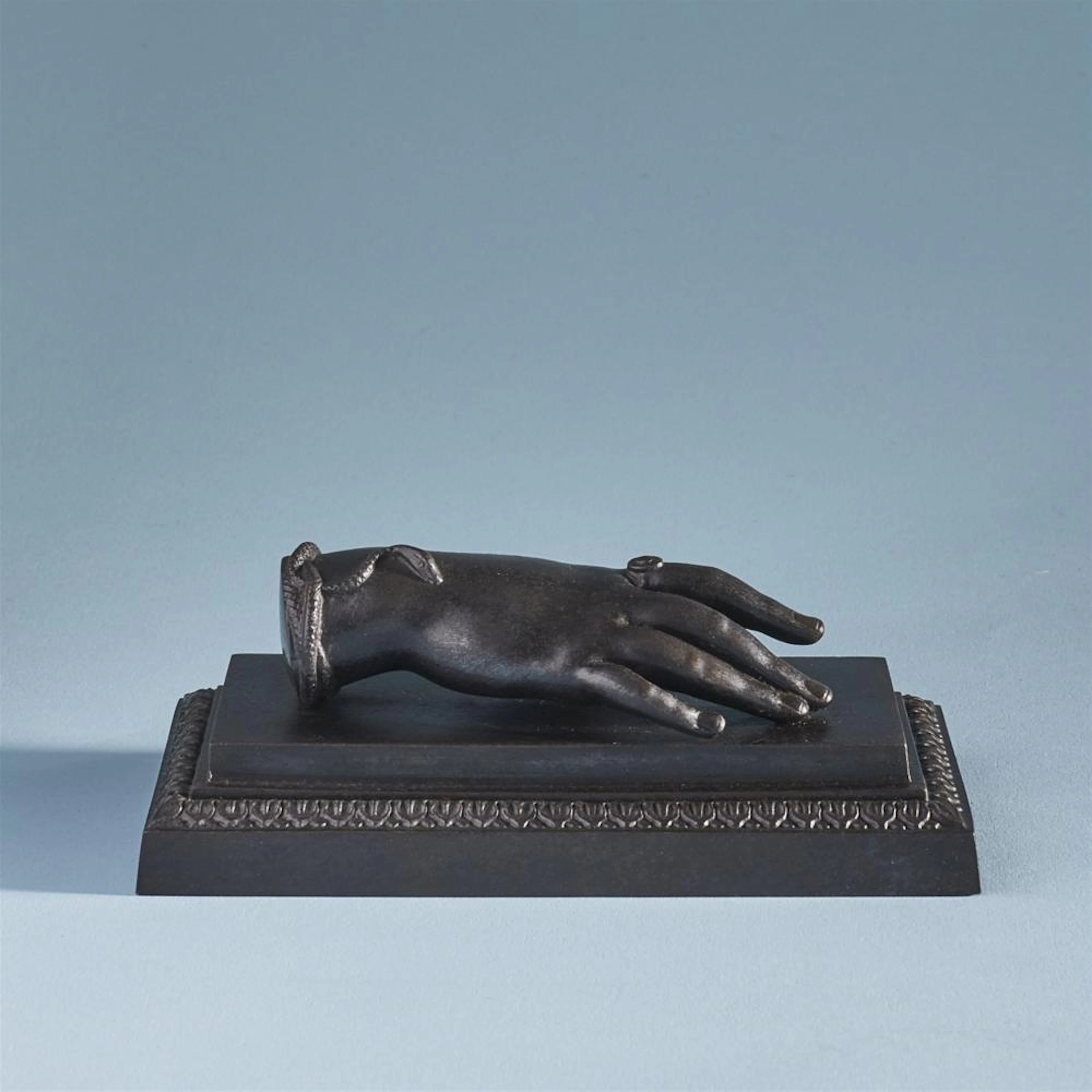 A cast iron ladies hand paperweight