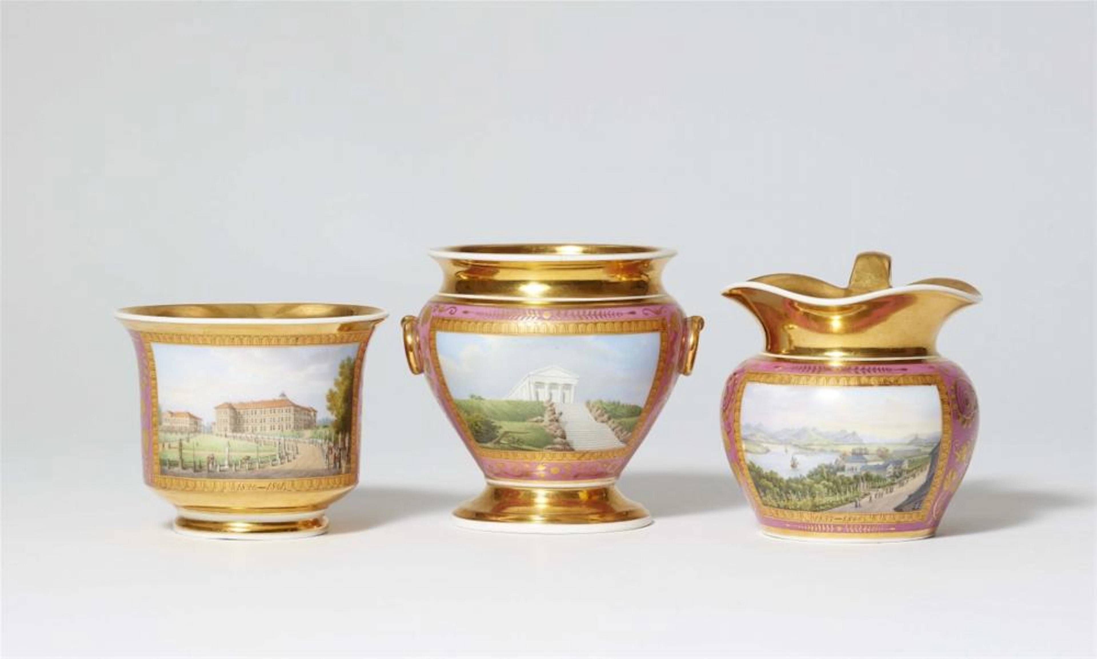 Three items from a Berlin KPM porcelain coffee service painted with views