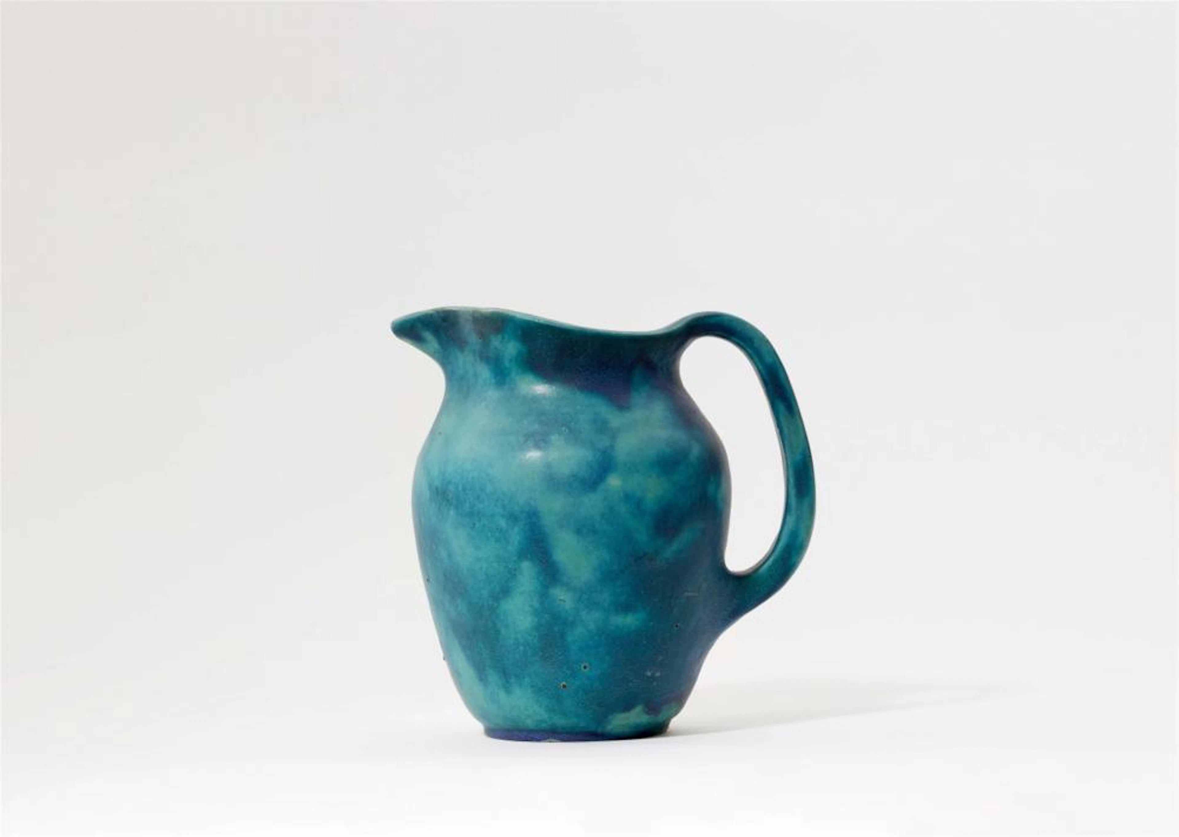 A stoneware water jug by Alexandre Bigot