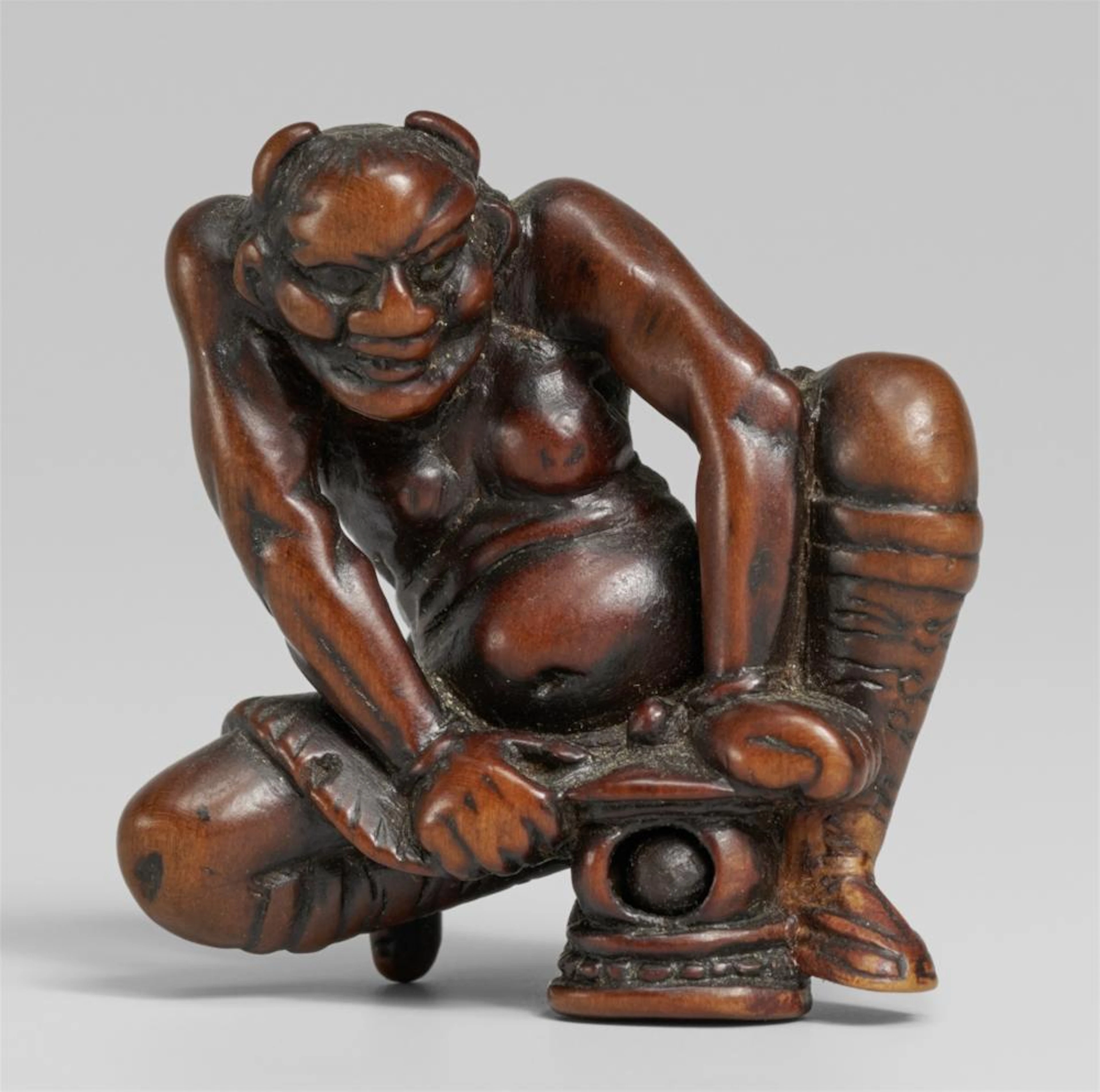 A boxwood netsuke of an oni. Around 1800