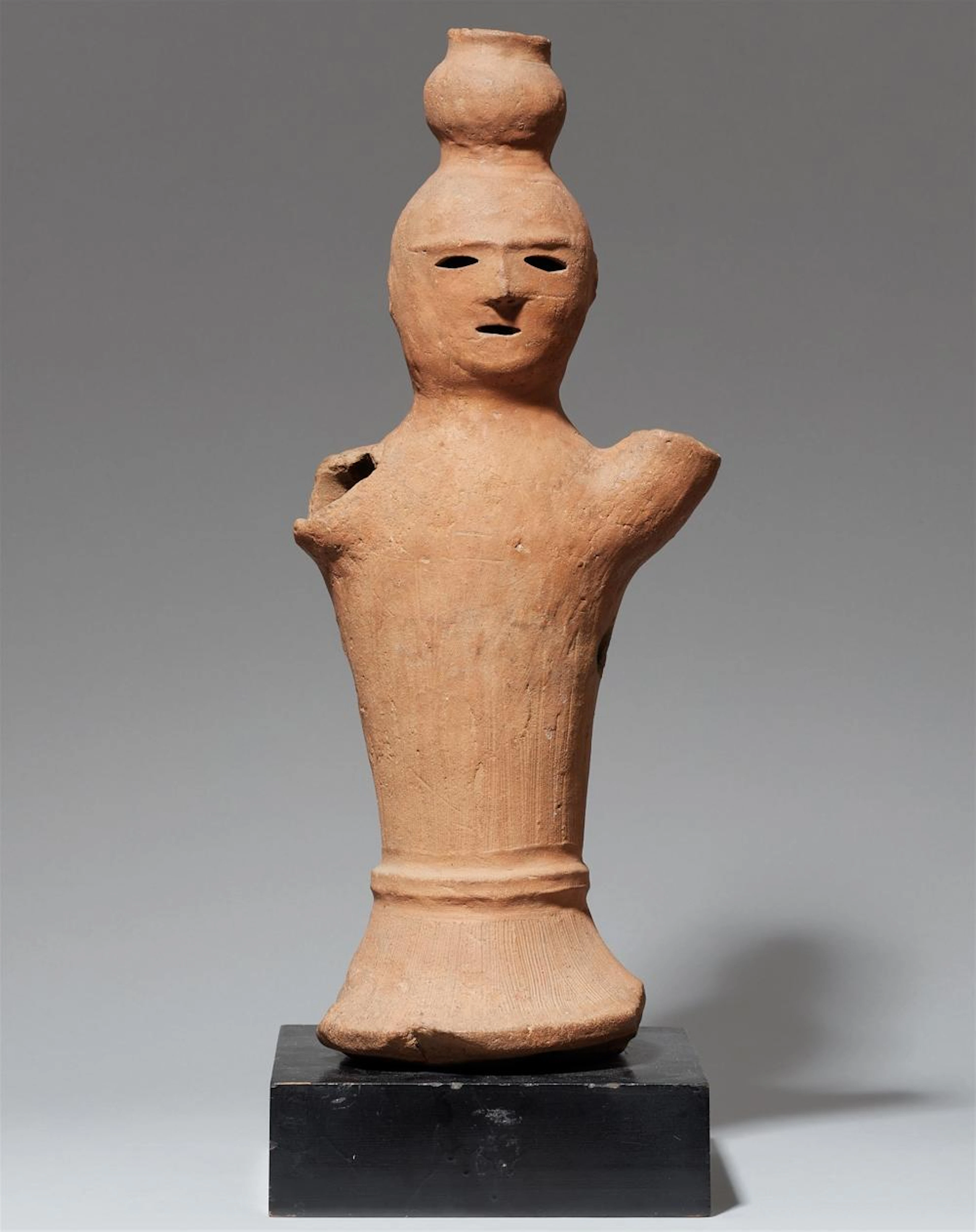A reddish clay haniwa figure. Kofun period, 6th/7th century