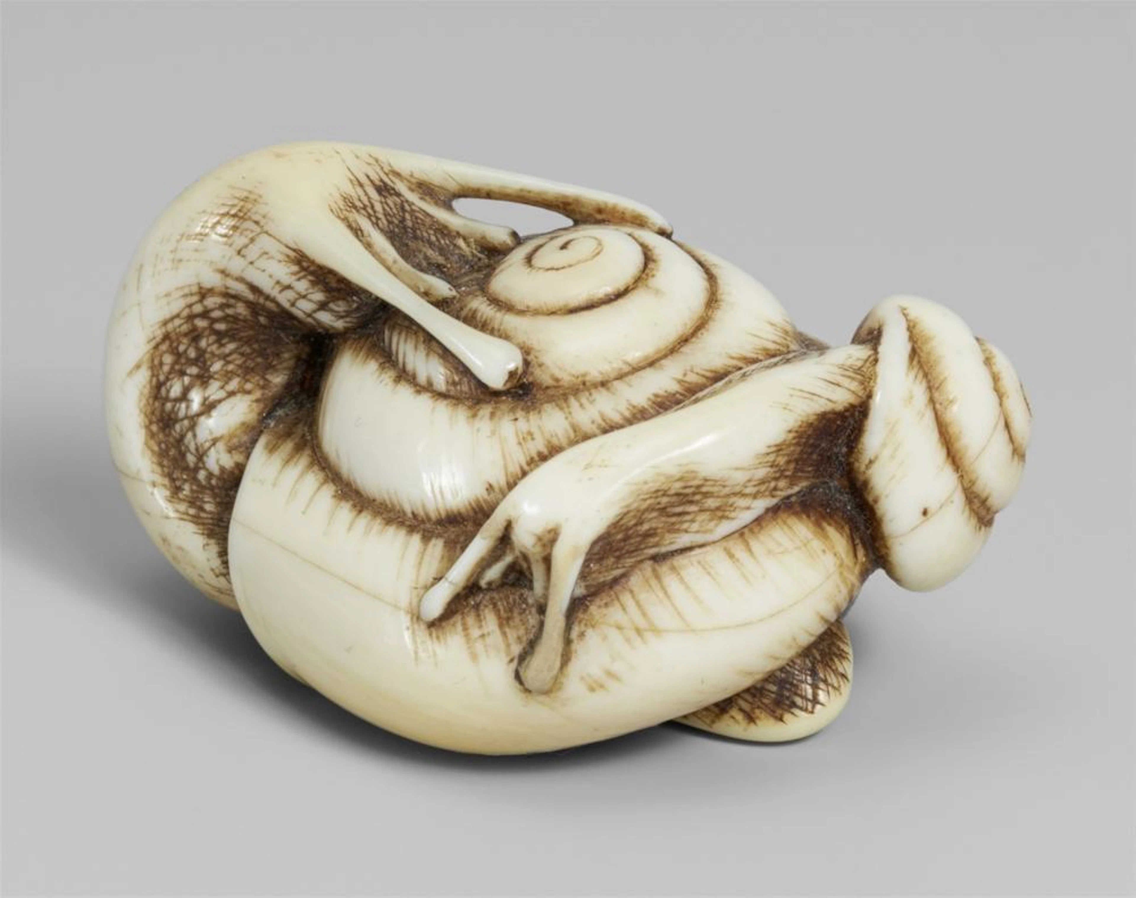 An ivory netsuke of two snails. 19th century
