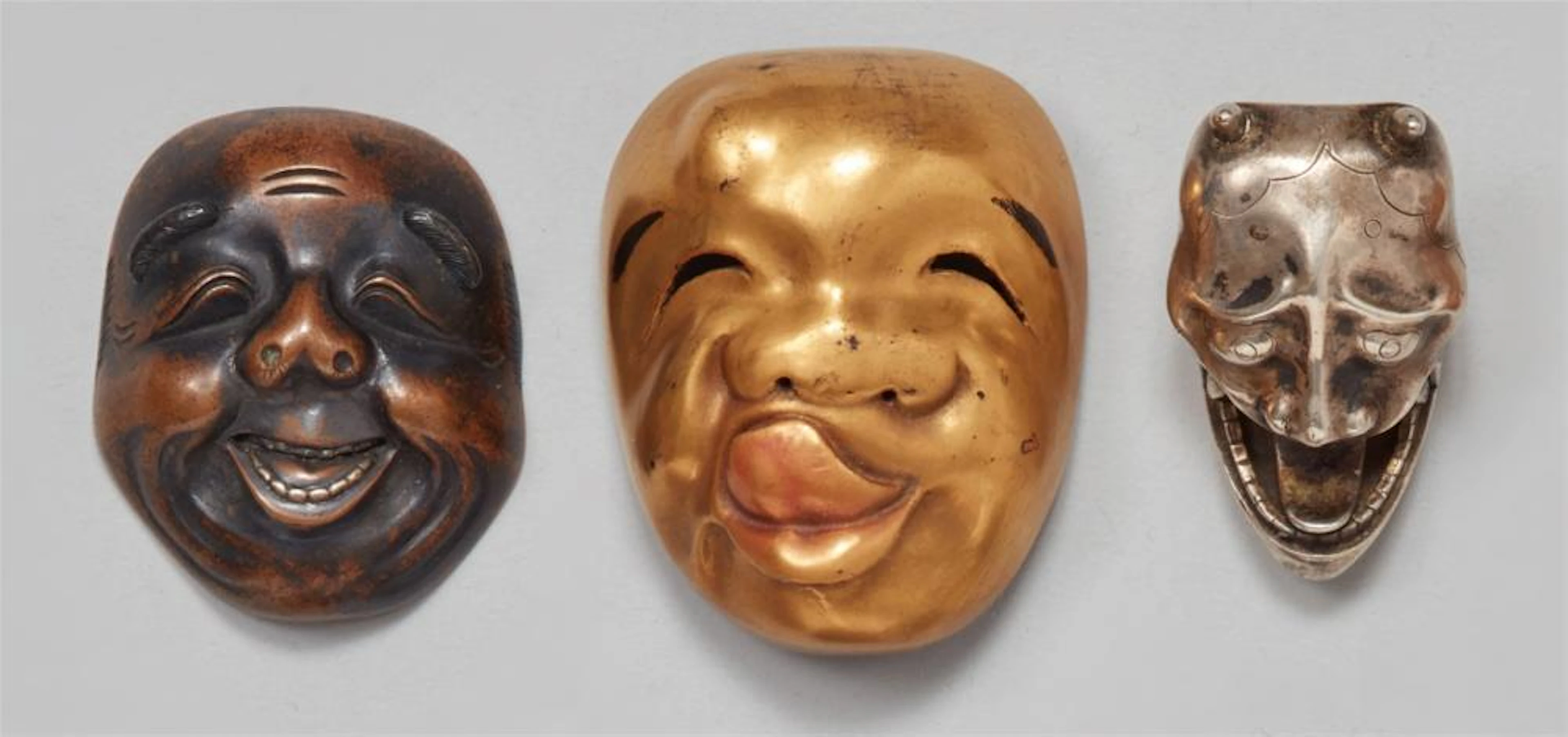Three mask netsuke. Second half 19th century