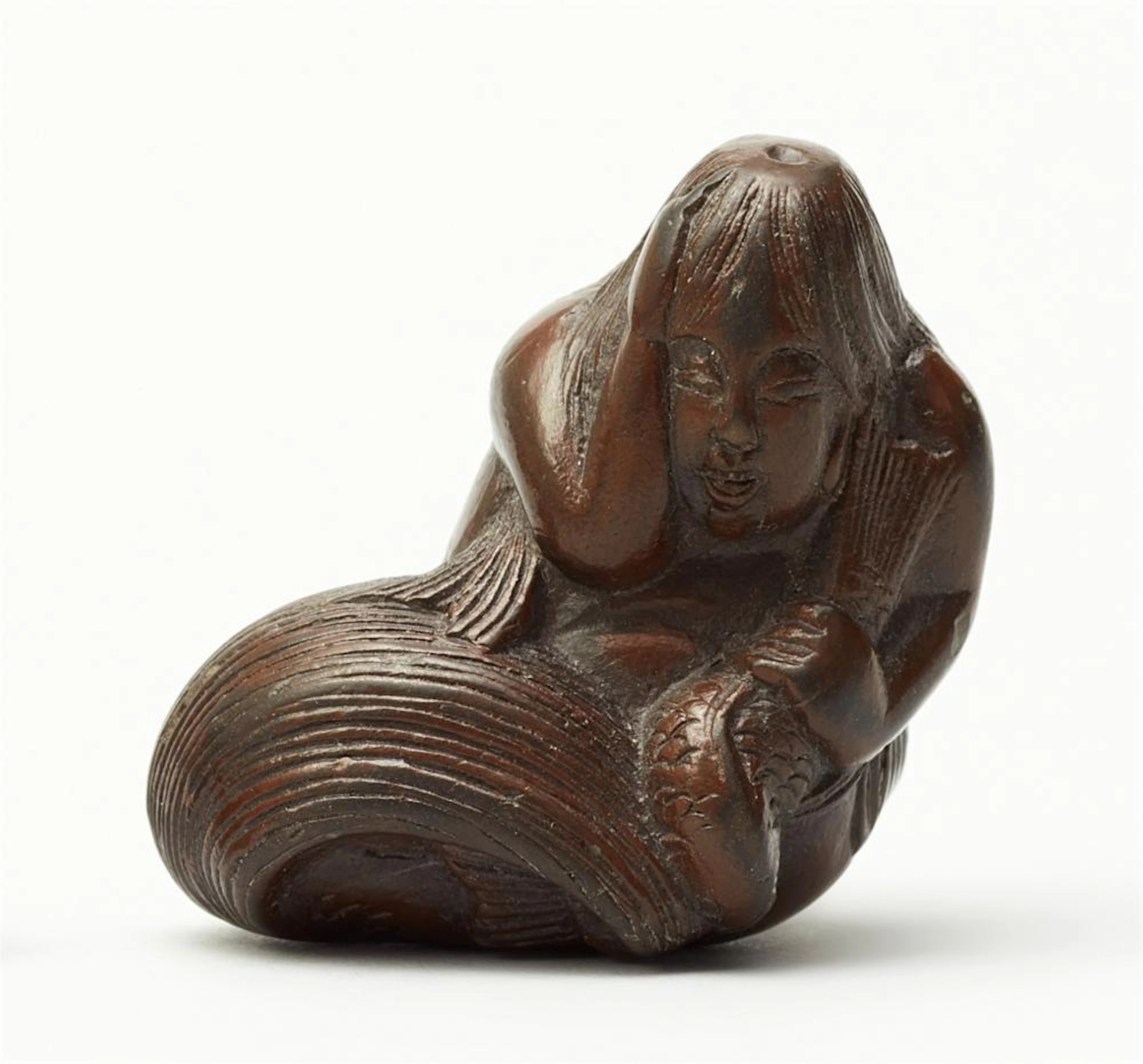 A yakimono netsuke of a mermaid (ningyo). 19th century