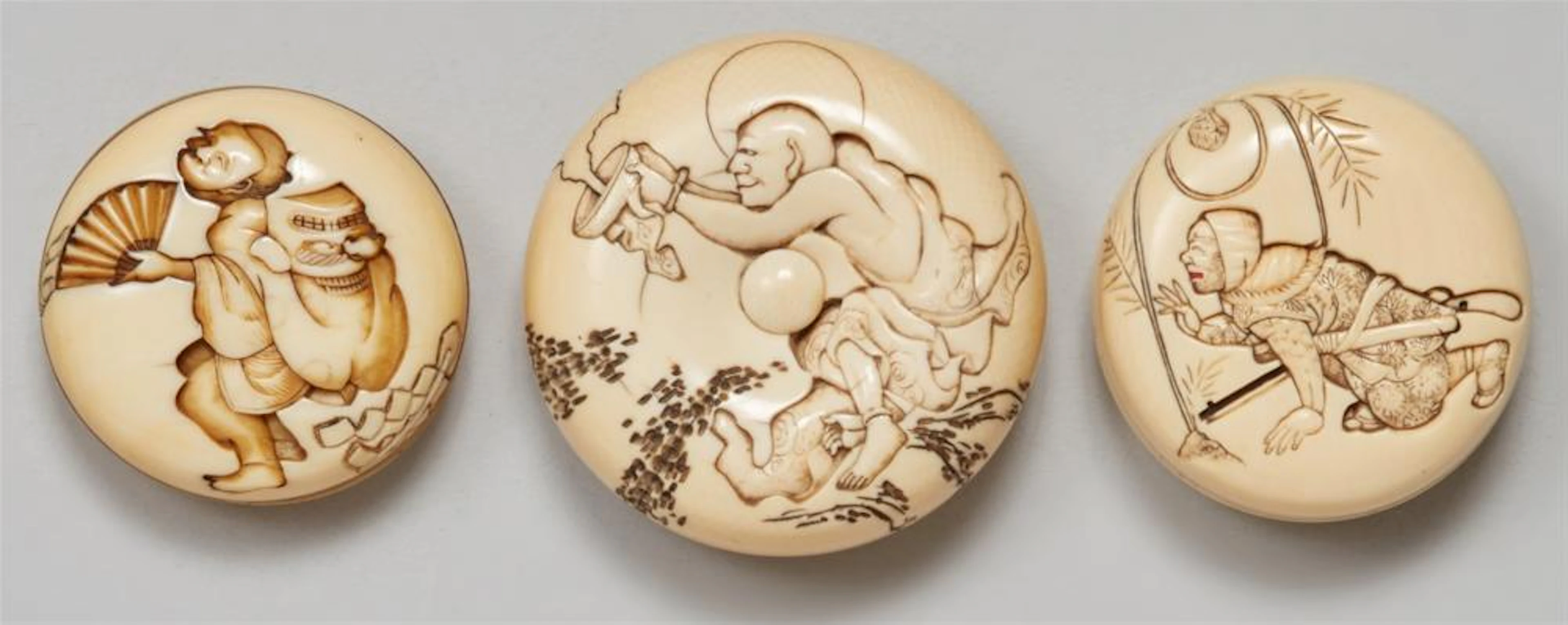 Three ivory manju netsuke. 19th century