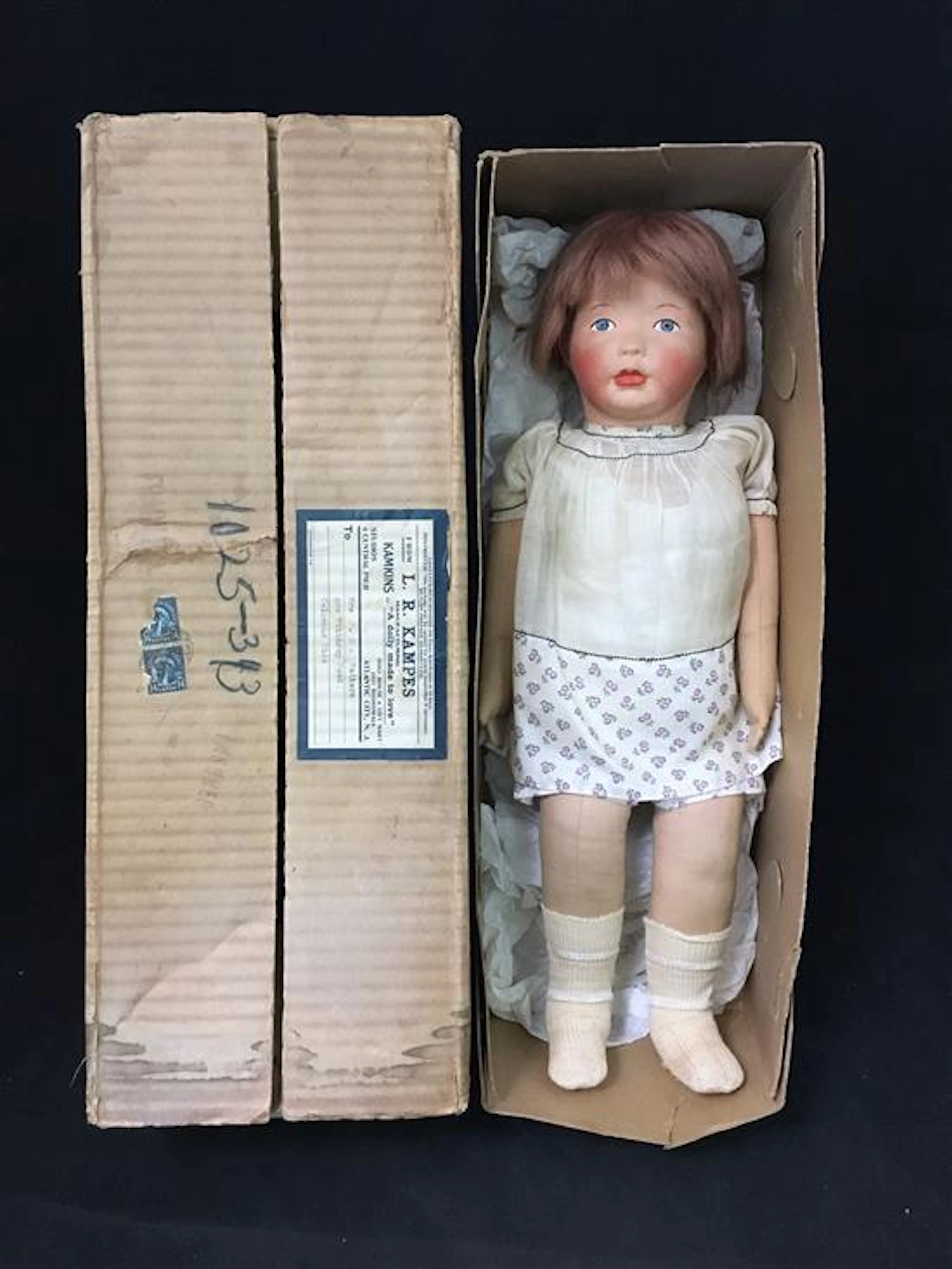 19" KAMKINS GIRL. MOLDED AND PAINTED CLOTH HEAD AND FACIAL FEATURES, MOHAIR WIG, TAB JOINTED ARMS AND STITCH JOINTED LEGS. WEARS O...