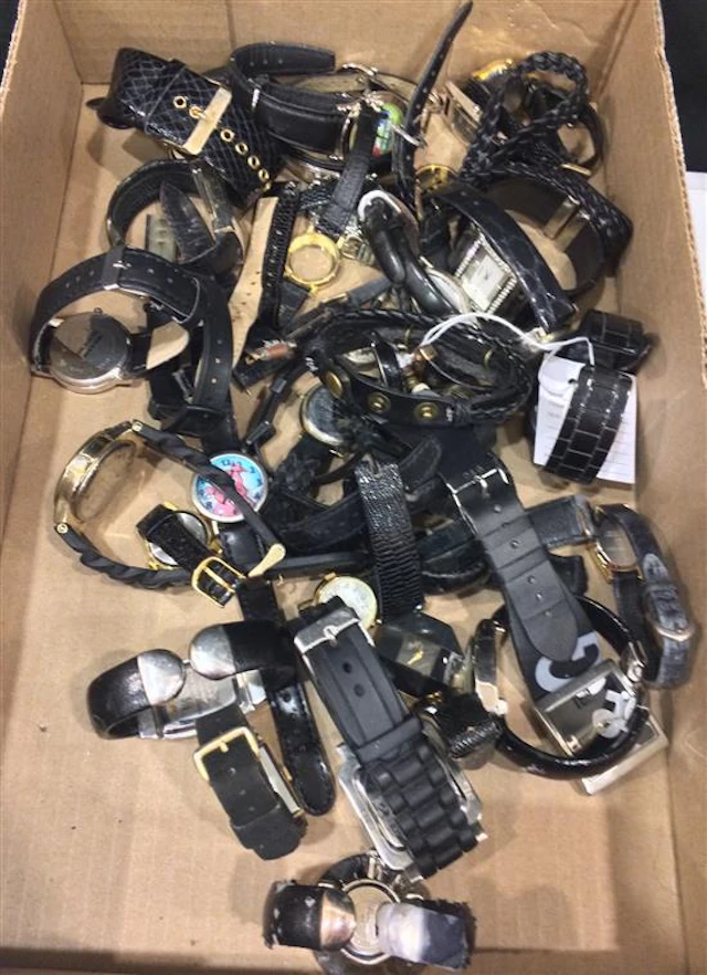 LOT OF MORE THAN TWO DOZEN LADIES' WRIST WATCHES WITH BLACK BANDS INCLUDING: WATCH FROM GENEVA WITH COW PRINT FACE FEATURING INSET D..