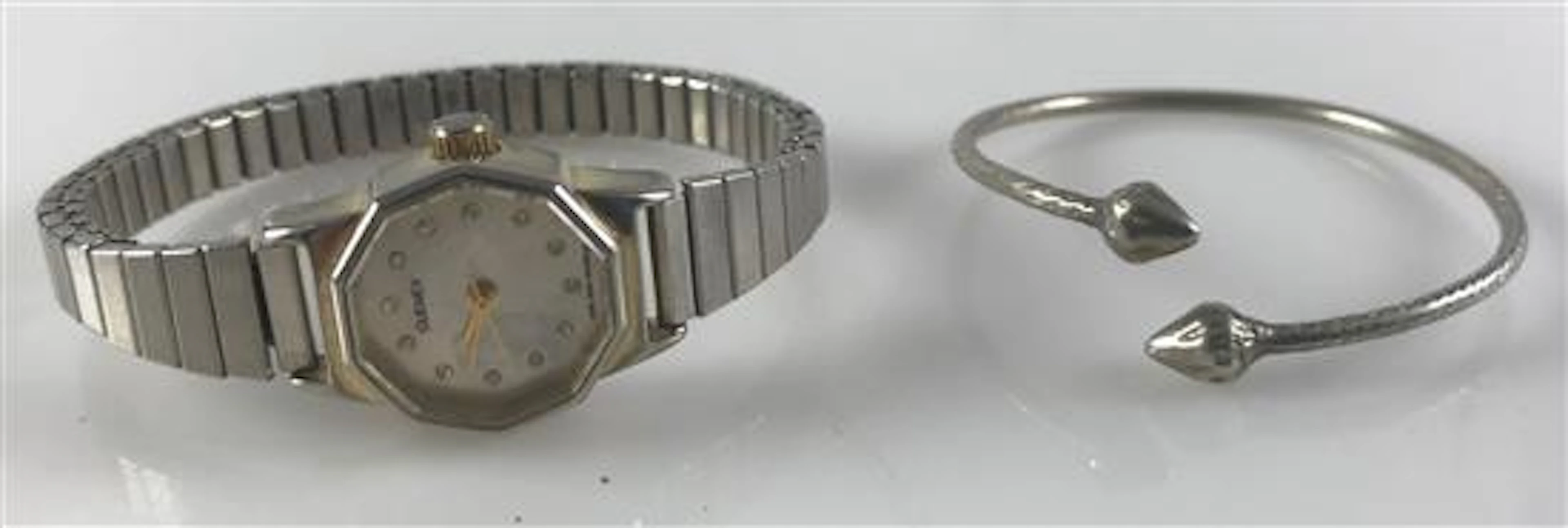 SILVER TONE ACCESSORIES INCLUDING ENGRAVED CHILD'S BRACELET AND A SILVER TONE STRETCH BAND WATCH FROM QUEMEX.