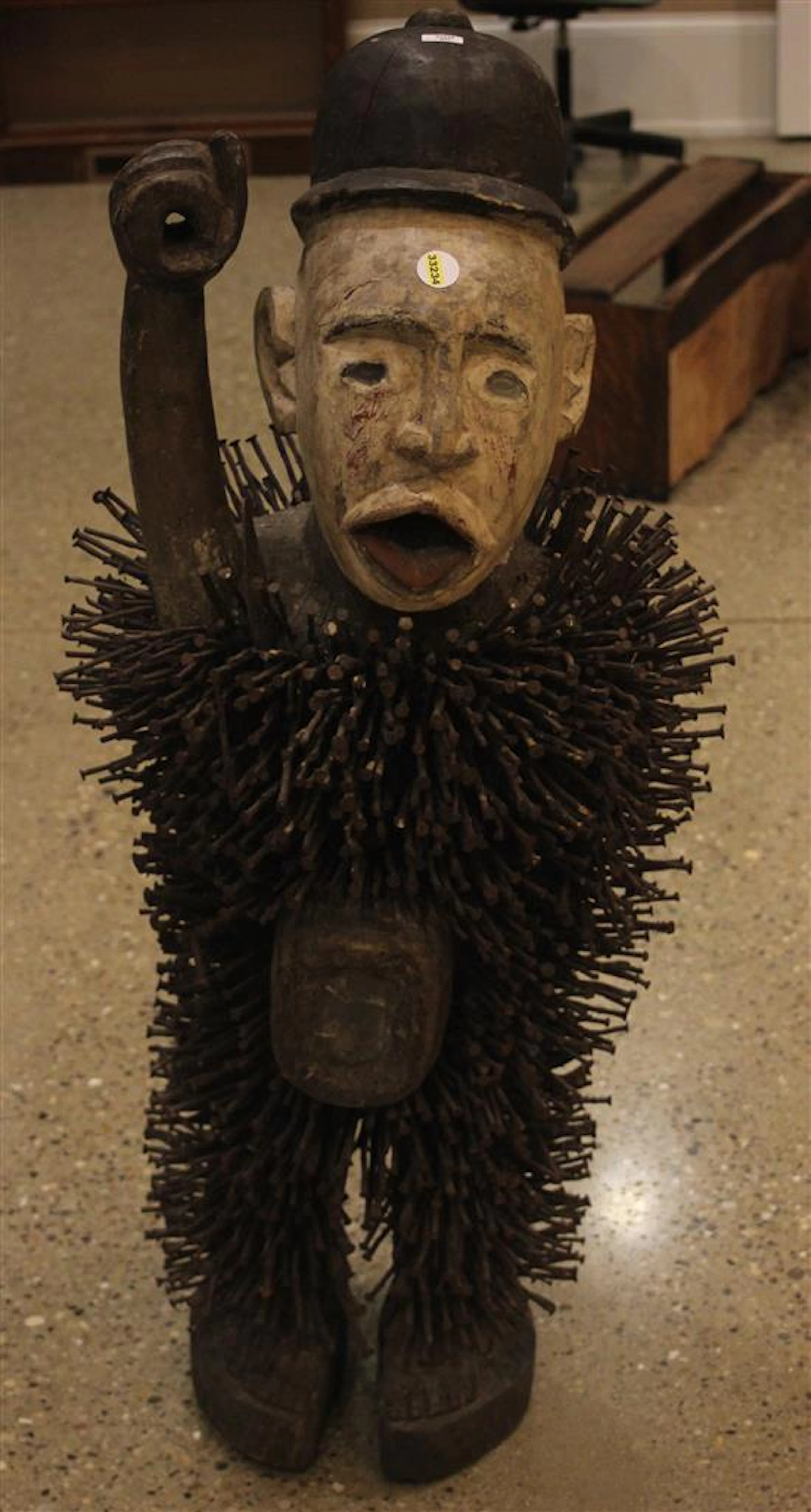AFRICAN NKISI NKONDI (GUARDIAN / HUNTER OF EVIL) WOODEN FIGURIENE, COVERED IN SEVERAL HUNDRED NAILS, APPROXIMATE 45 INCHES TALL, FEA...