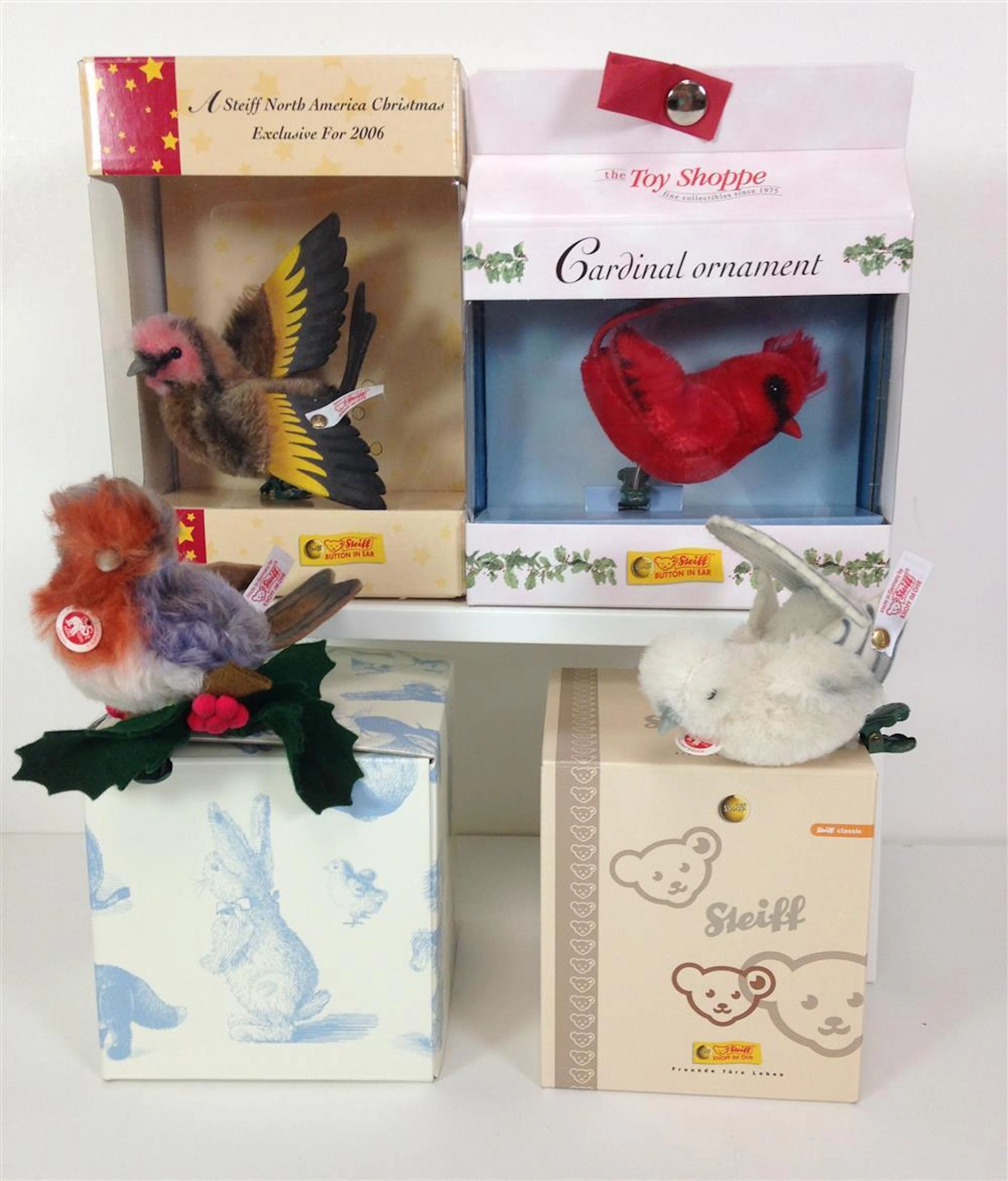 (4) STEIFF CLIP-ON CHRISTMAS TREE BIRD ORNAMENTS. INCLUDES TOY SHOPPE EXCLUSIVE "CARDINAL", RED MOHAIR HEAD AND BODY WITH RED FELT T...