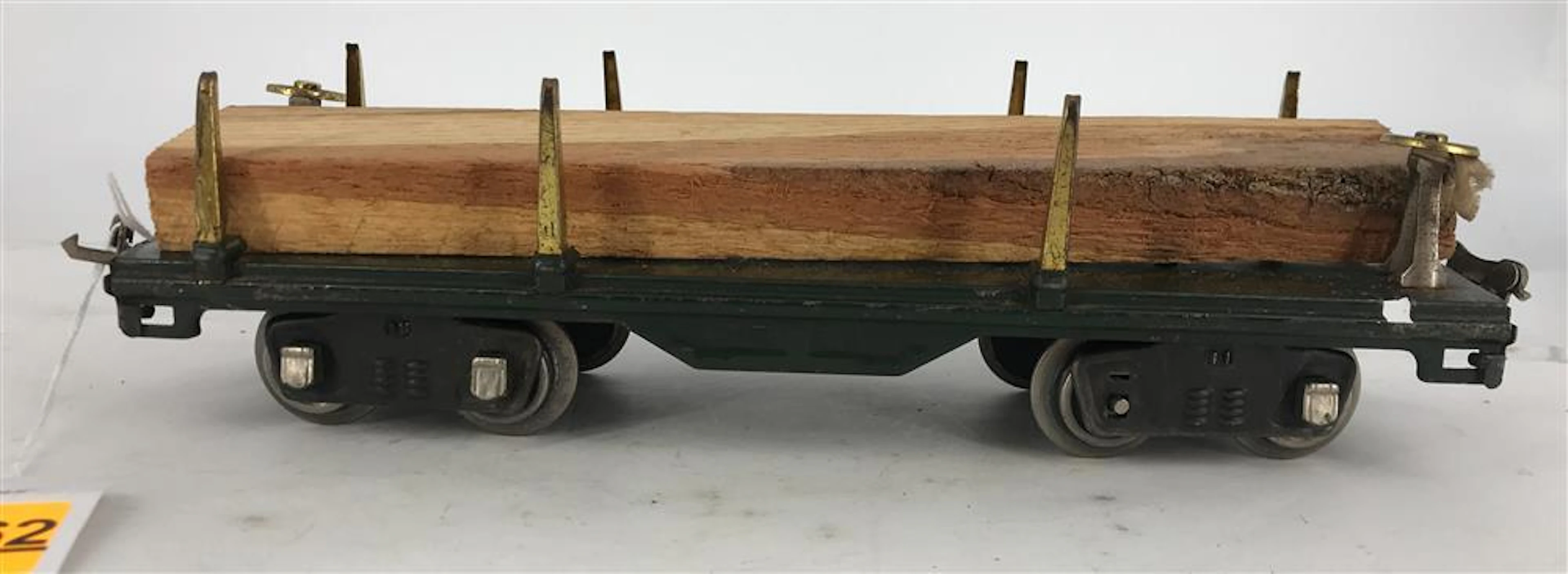 LIONEL PRE-WAR STANDARD GAUGE 511 FLATCAR, DARK GREEN, WITH WOOD
