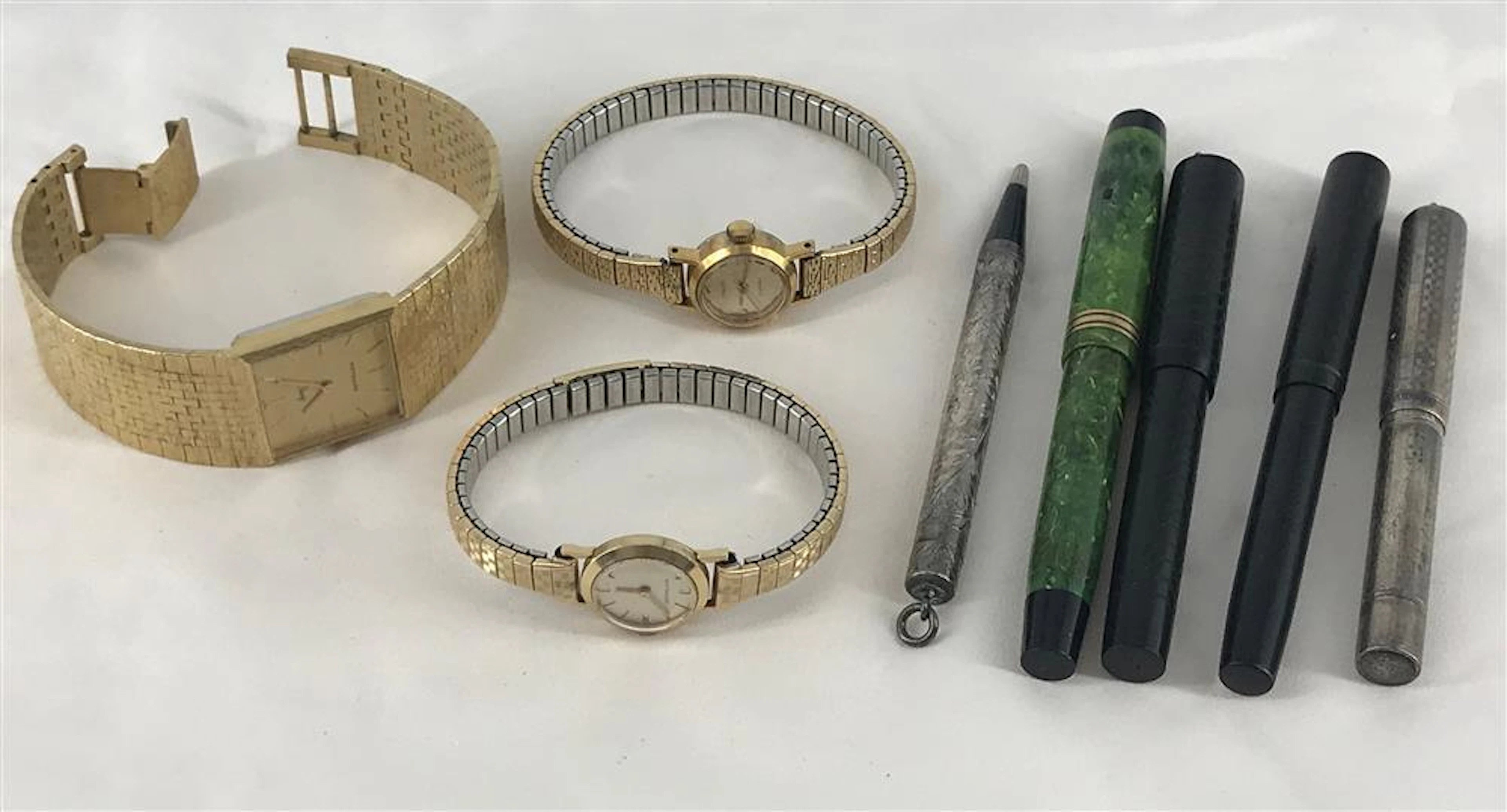 THREE WATCHES AND FIVE WRITING UTENSILS