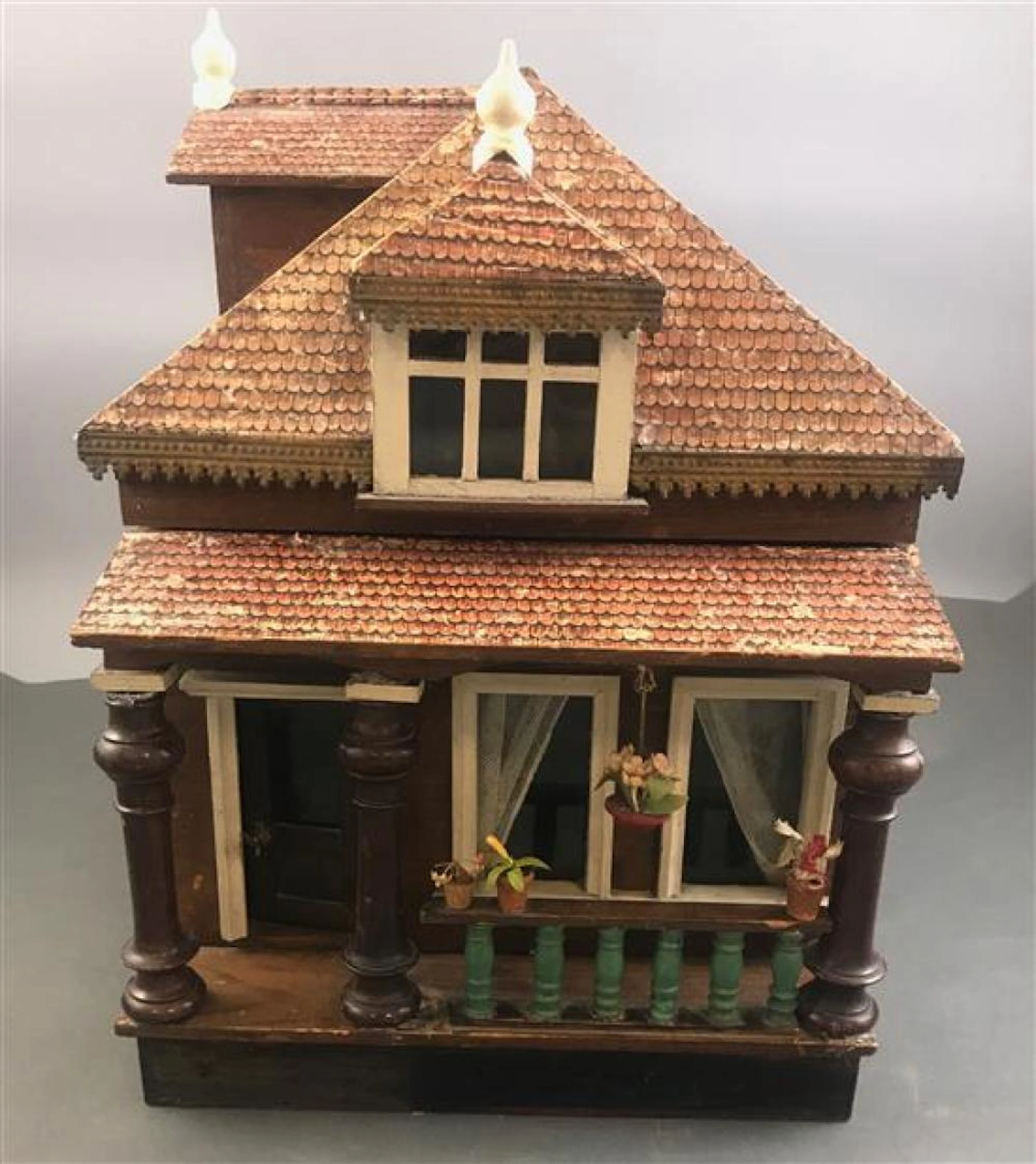 EARLY WOOD DOLL HOUSE, LIKELY GOTTSCHALK. TWO STORY VICTORIAN STYLE WITH LITHO ROOF, PRESSED TIN AT ROOF LINE, COVERED FRONT PORCH....