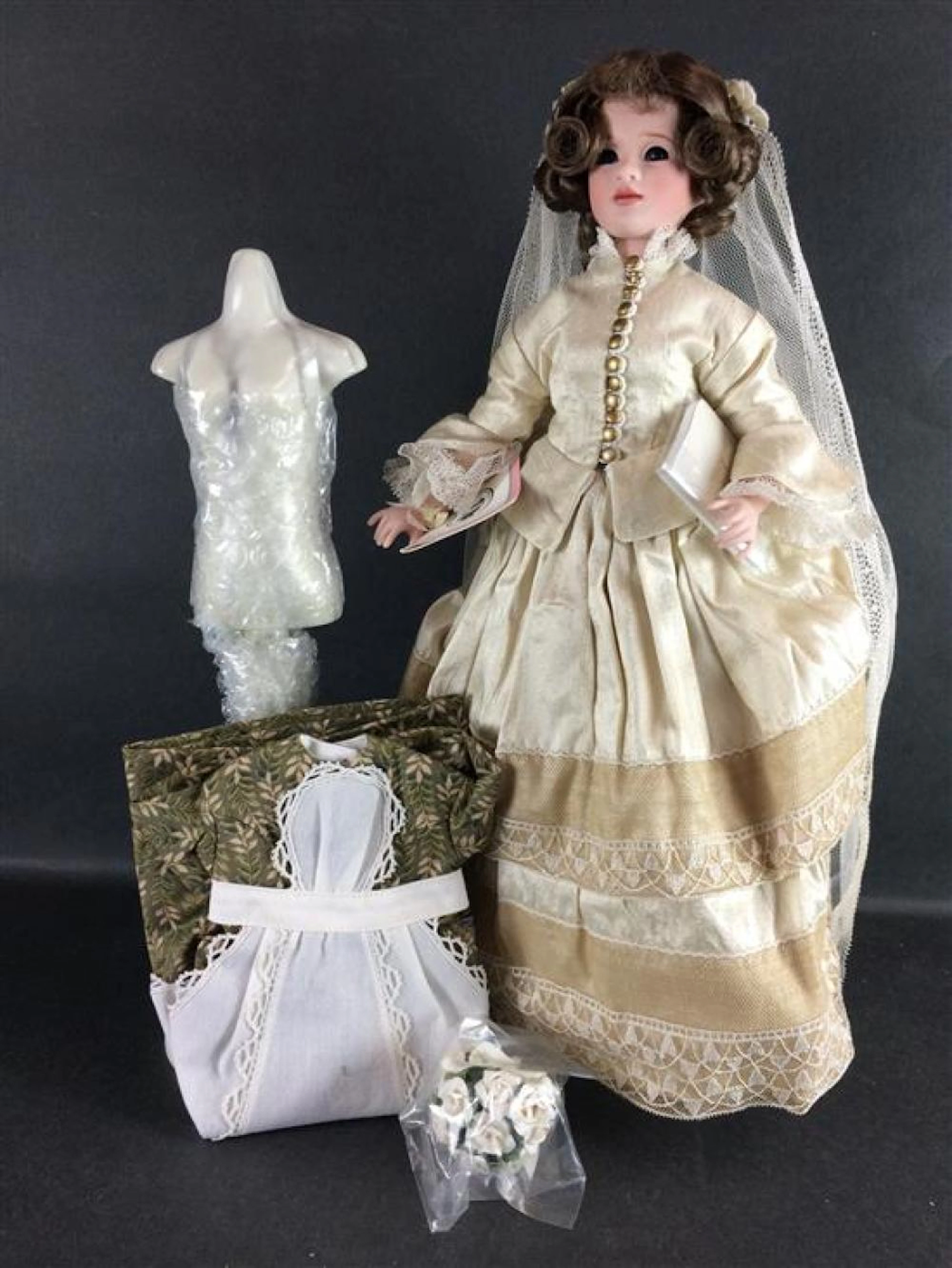 14" WENDY LAWTON "MEG'S WEDDING" FROM THE LITTLE WOMEN COLLECTION. PORCELAIN HEAD, TORSO AND ARMS ON LOWER WOOD JOINTED BODY WEARIN...
