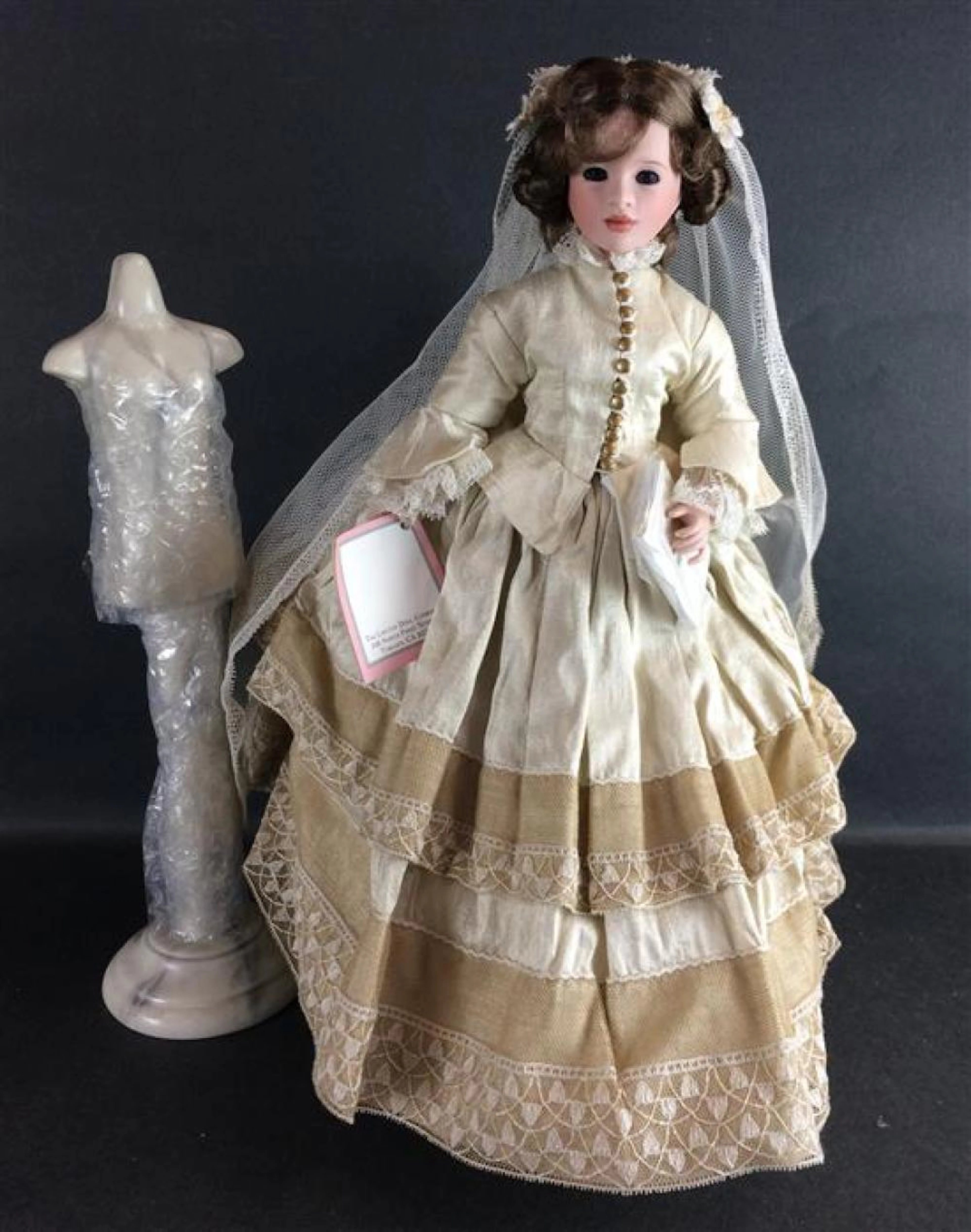 14" WENDY LAWTON "MEG'S WEDDING" FROM THE LITTLE WOMEN COLLECTION. PORCELAIN HEAD, TORSO AND ARMS ON LOWER WOOD JOINTED BODY WEARIN...