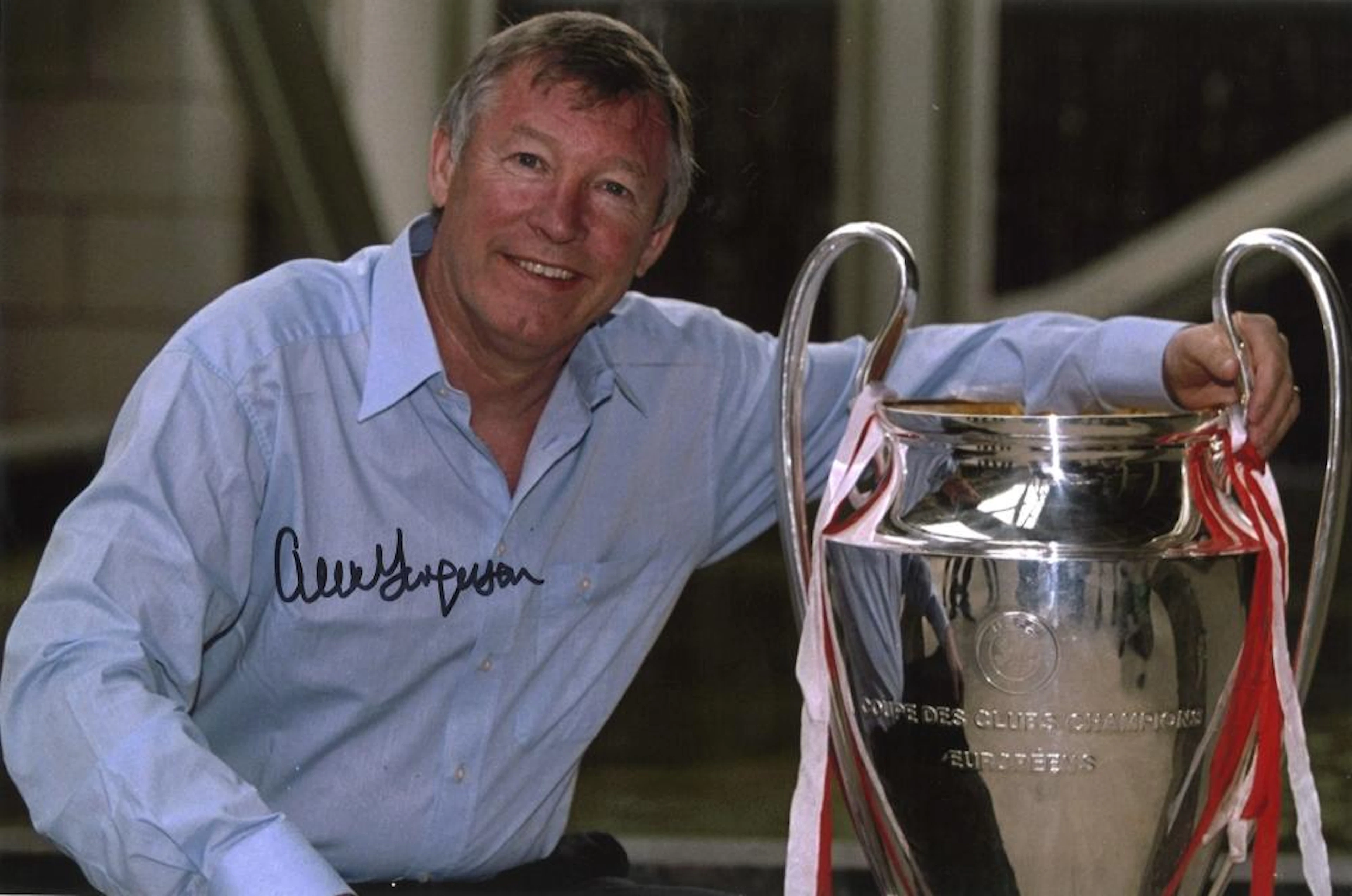 Football Sir Alex Ferguson signed 12x8 colour photo pictured with the champions league trophy