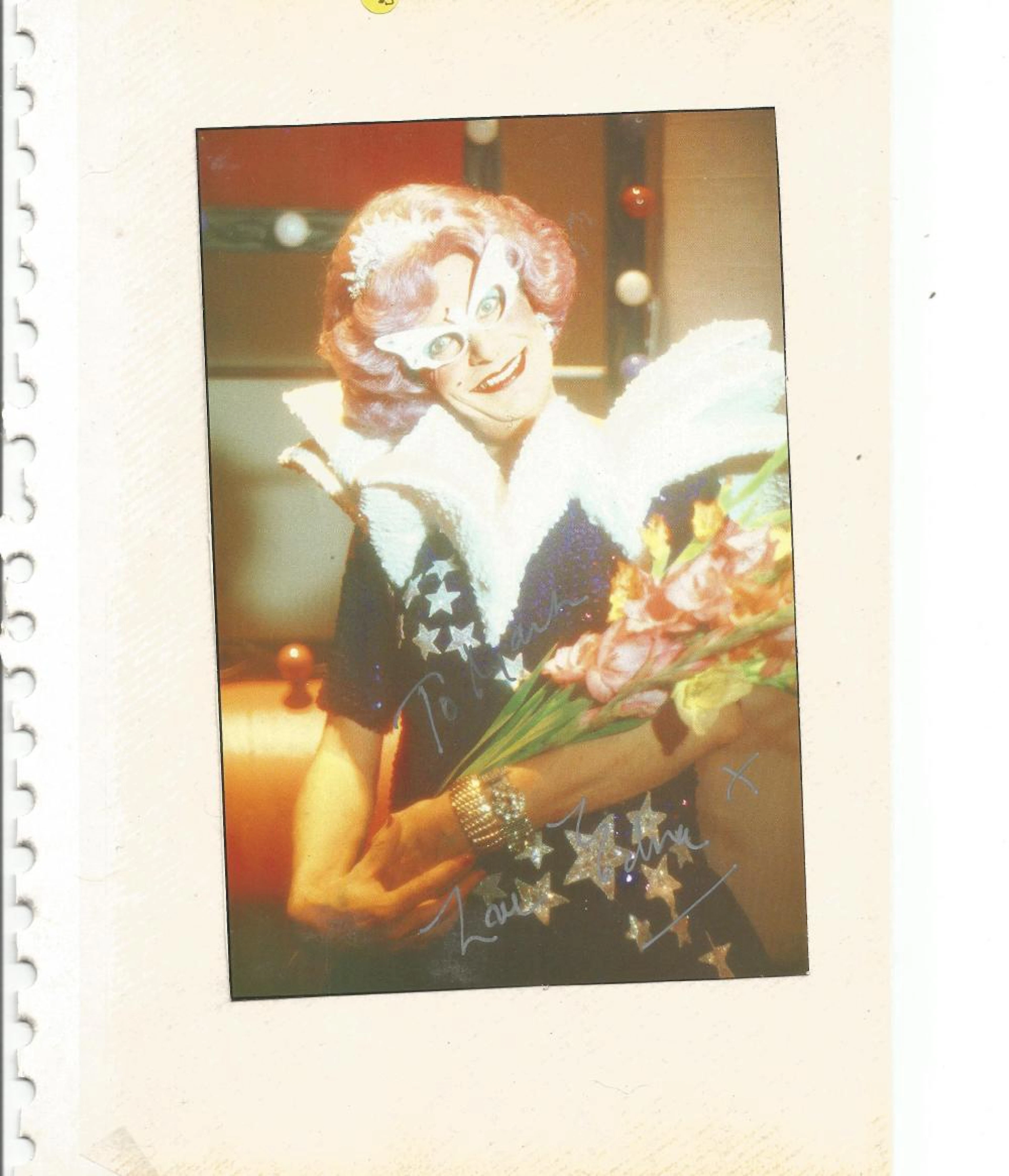 Dame Edna Everage signed 7x5 colour photo stuck to album page. Good Condition. All autographed items