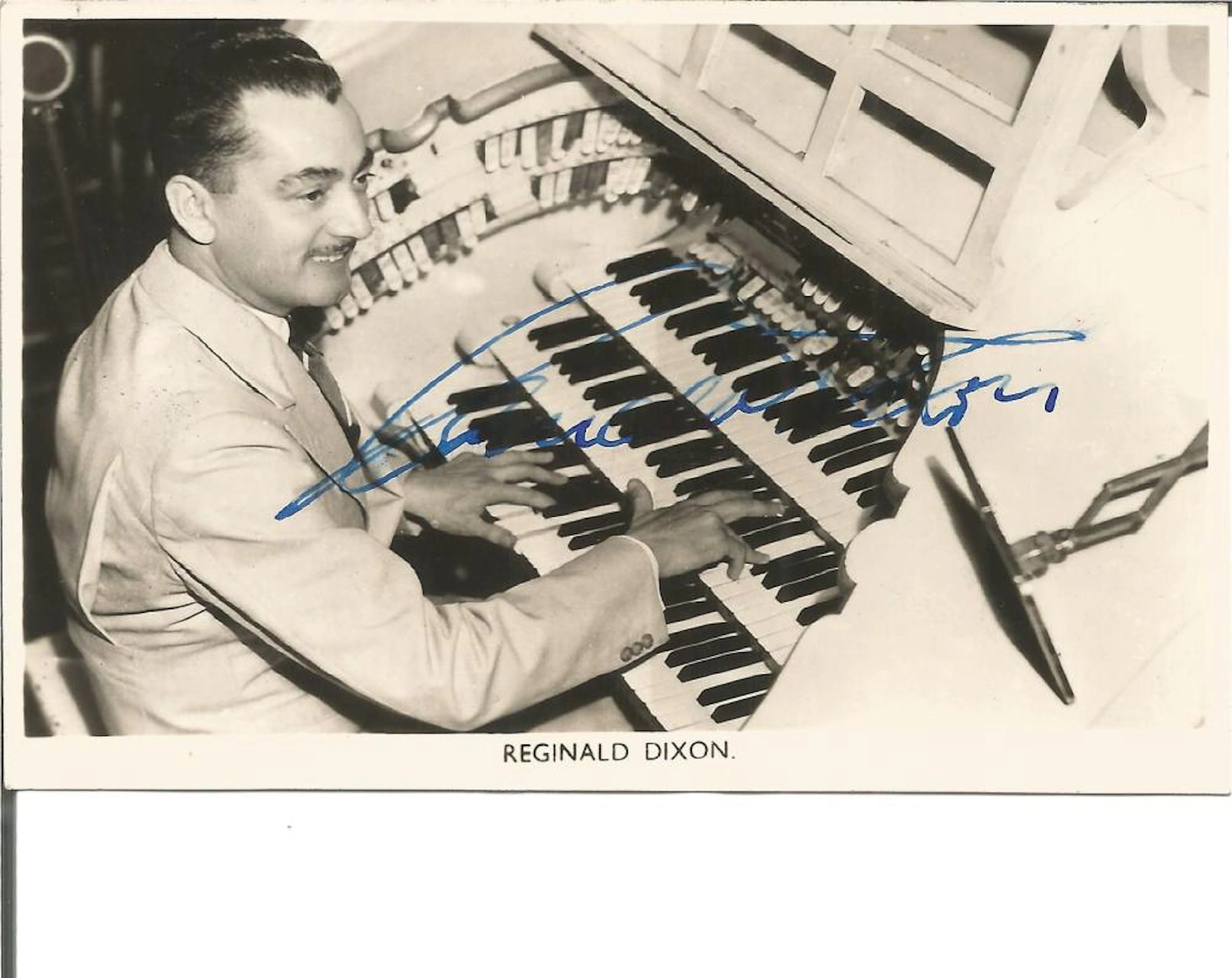 Reginald Dixon signed vintage 6 x 4 photo at his organ. Comes with biography information. TV Film