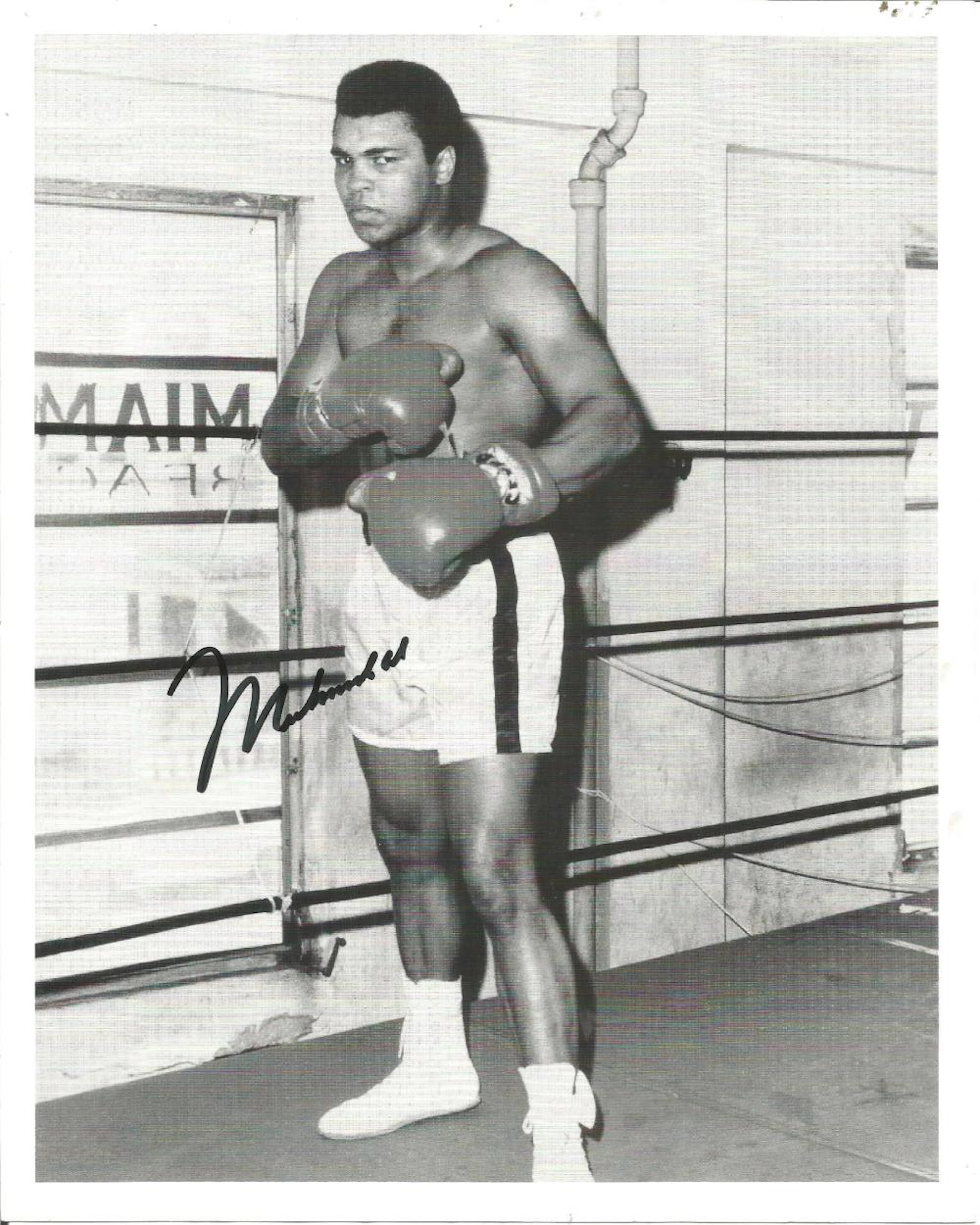 Muhammad Ali signed 10 x 8 b/w photo standing in the ring. Muhammad Ali born Cassius Marcellus
