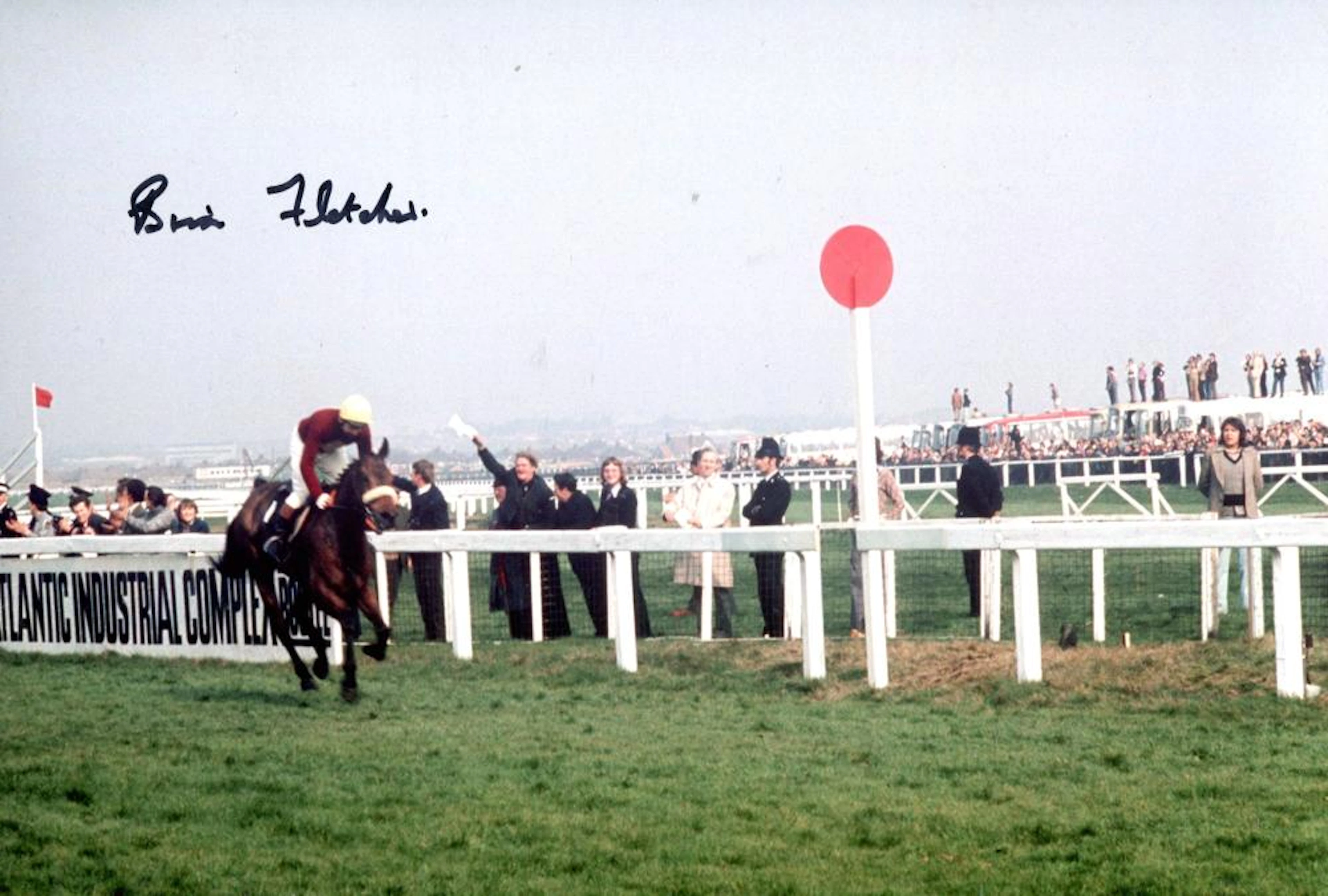 Red Rum. 8x12 inch photo of Red Rum winning the Grand National signed by the horses jockey, the late