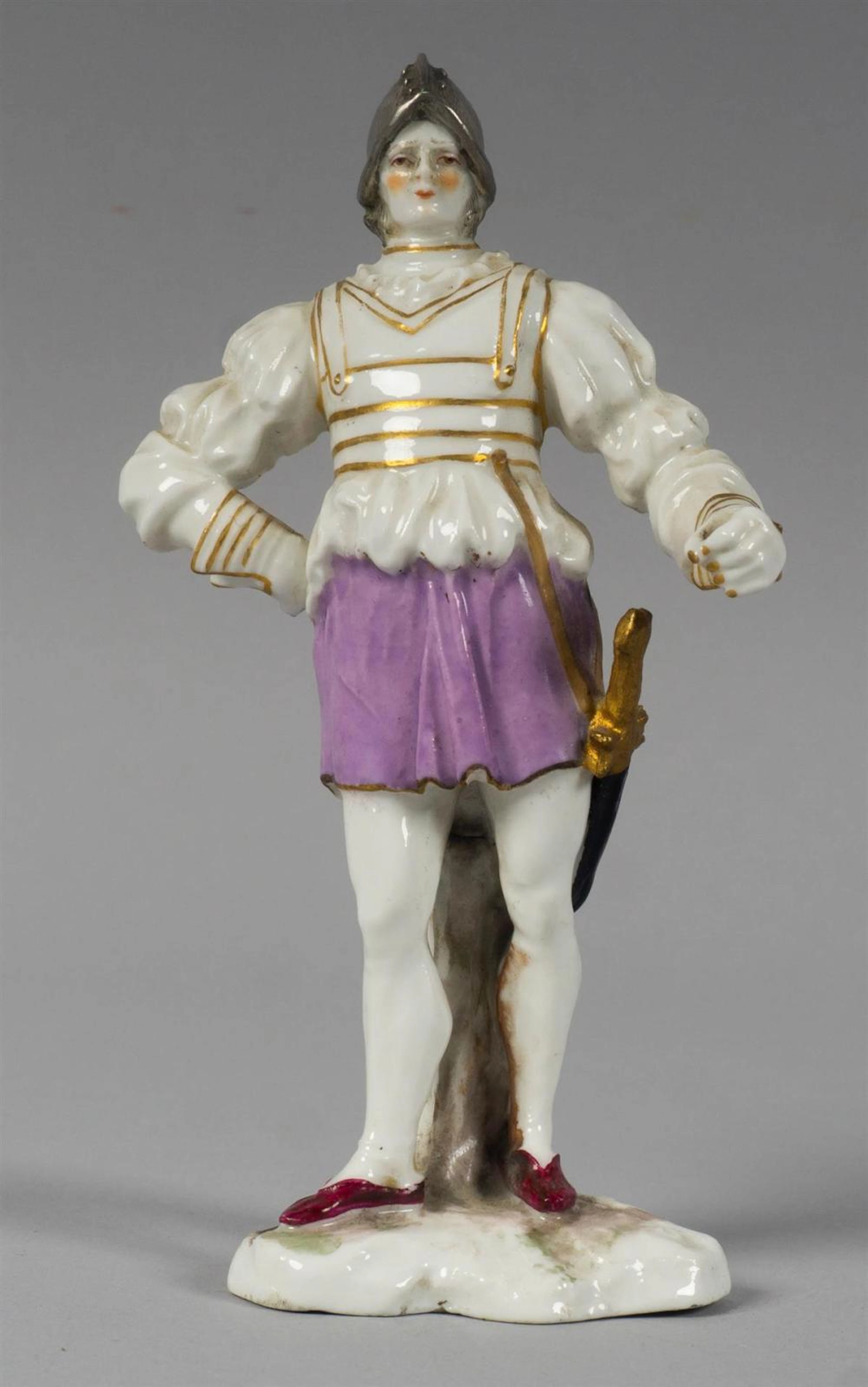 CONTINENTAL PORCELAIN FIGURE OF A MEDIEVAL EUROPEAN SOLDIER