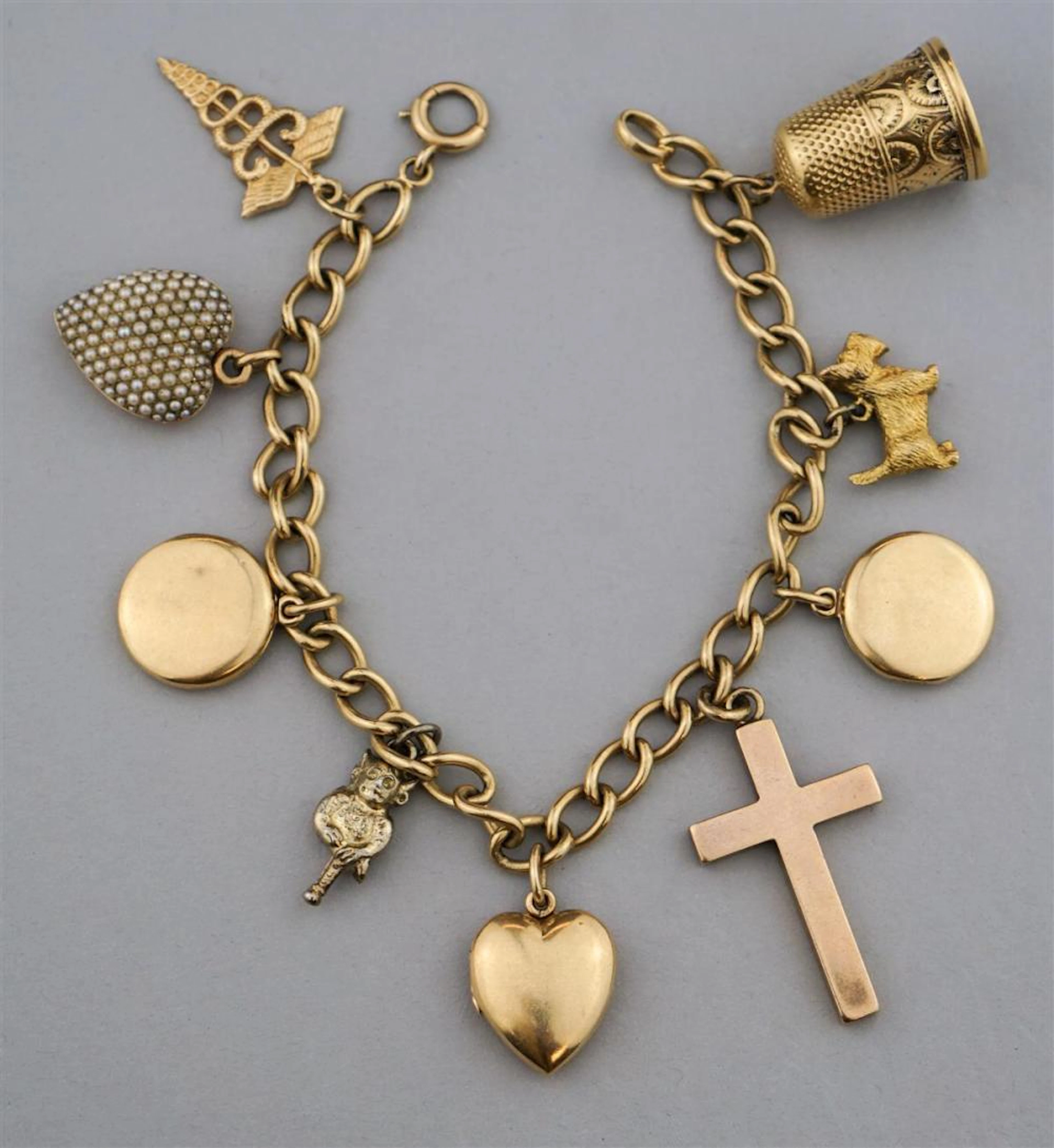 14K CHARM BRACELET WITH NINE 14K CHARMS