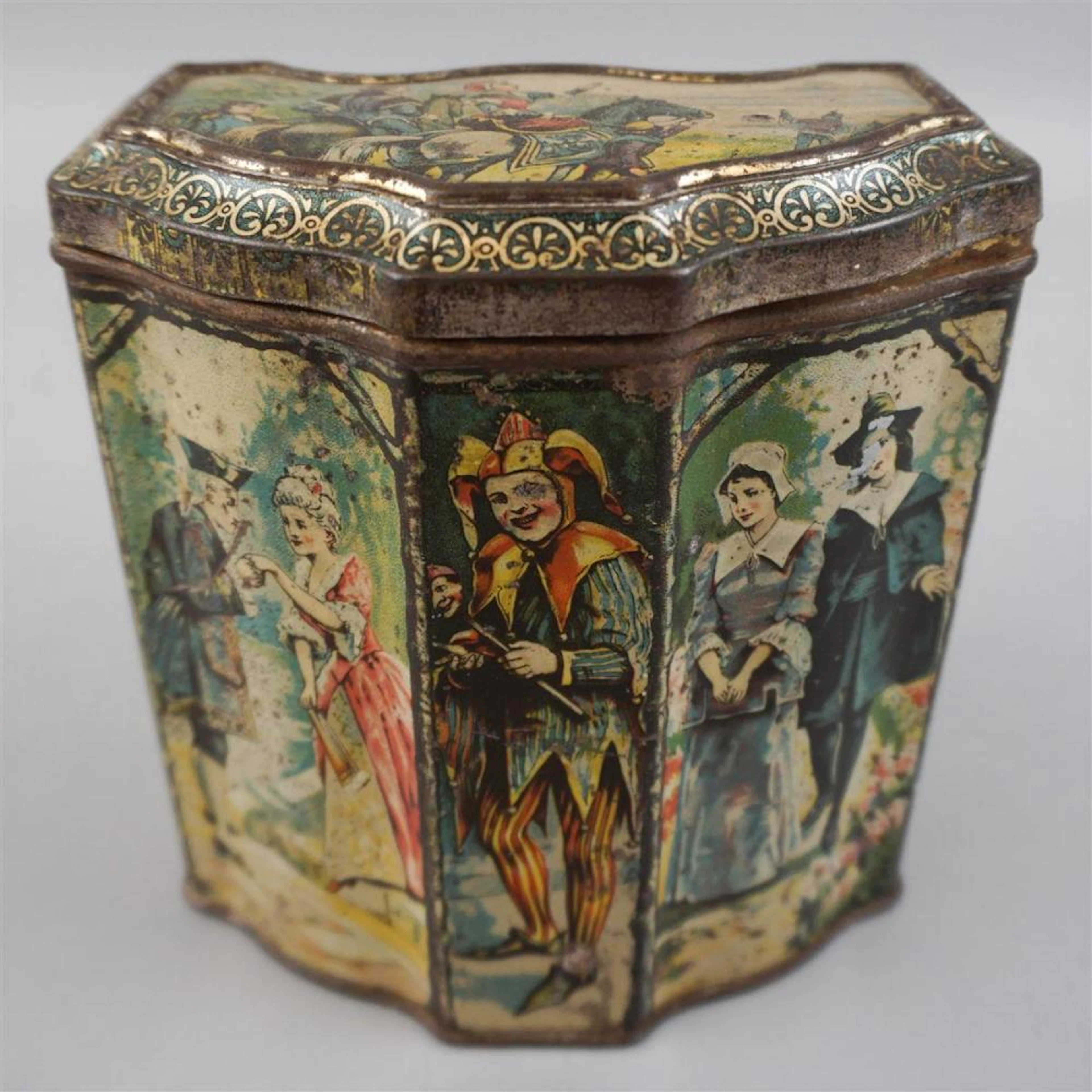 ENGLISH TIN BISCUIT JAR WITH 'OLDEN TIMES SCENE' AND JESTER
