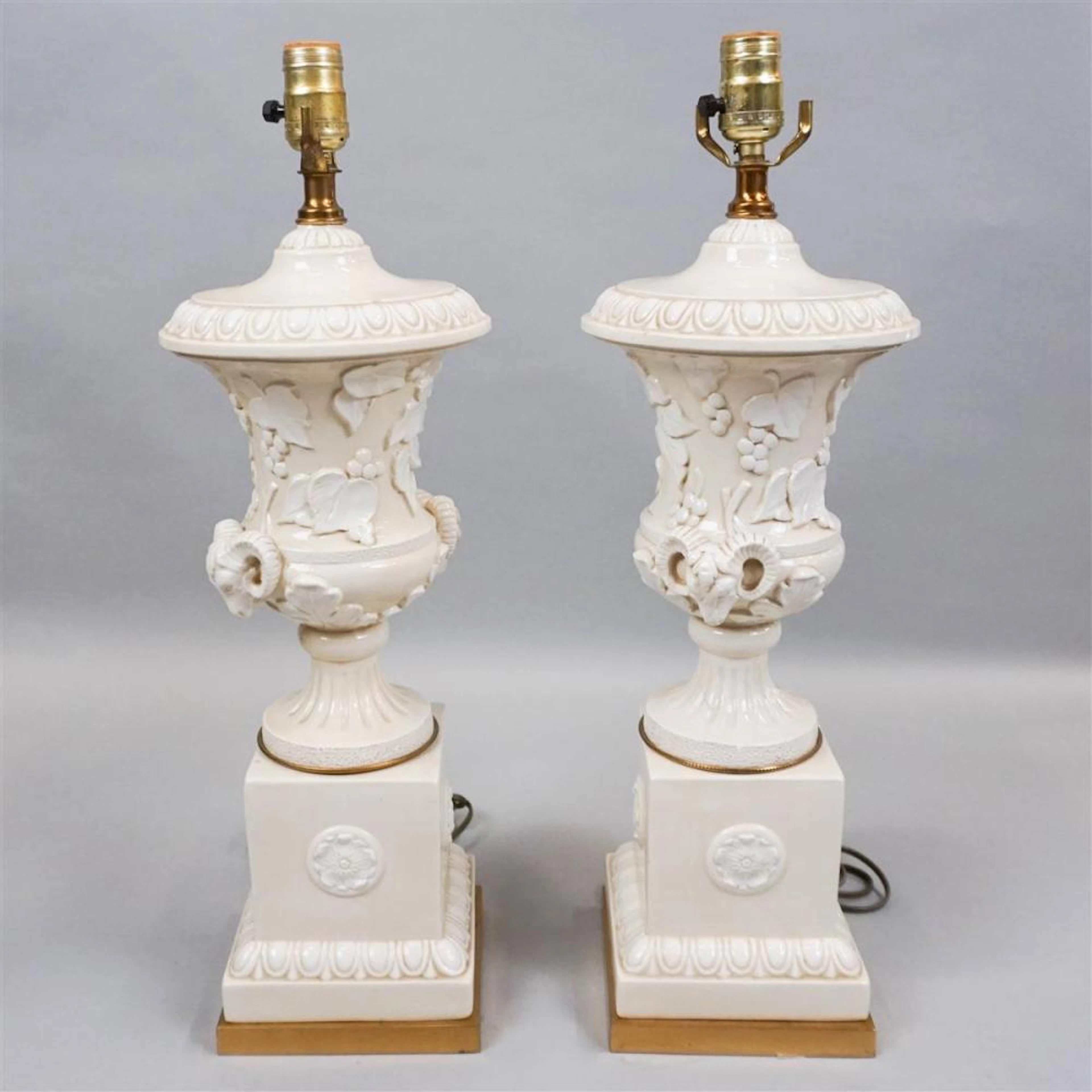 PAIR OF NEOCLASSICAL CREAM AND WHITE CERAMIC LAMPS