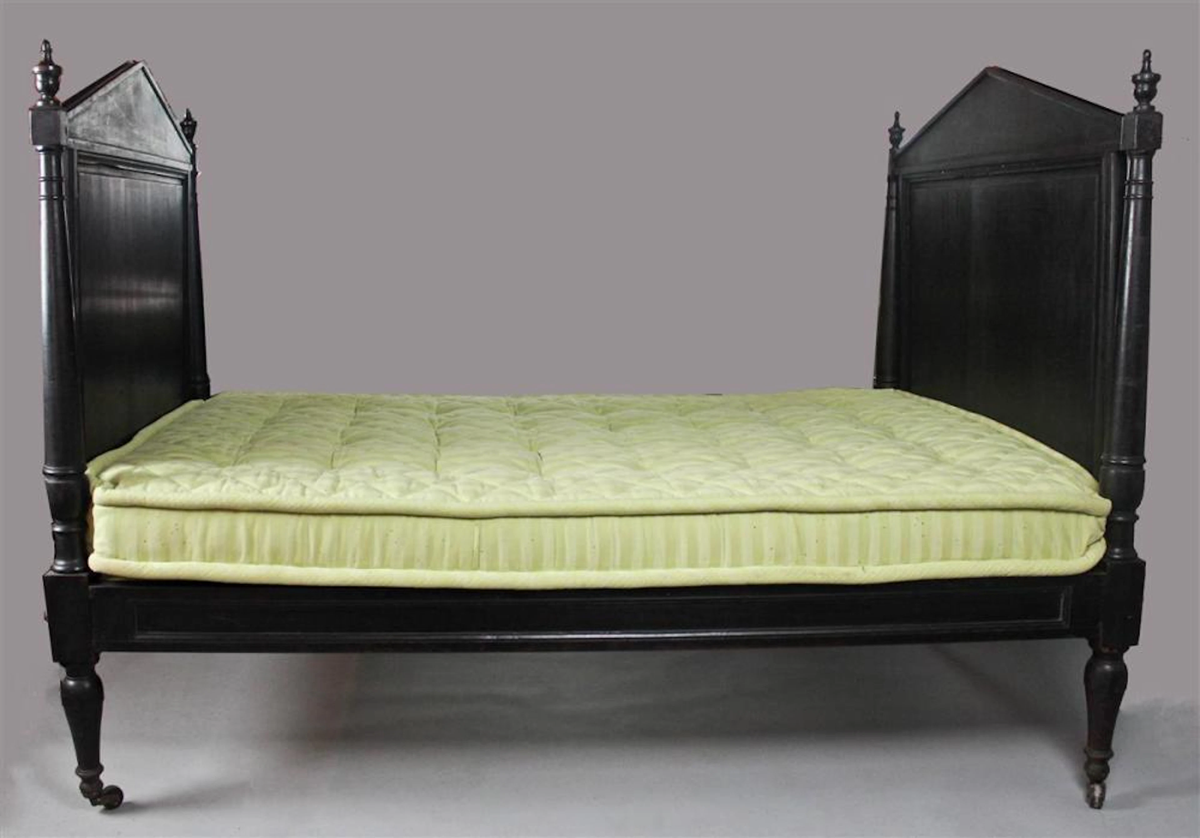 19TH CENTURY CARPENTER GOTHIC EBONIZED WOOD ROPE BED HEADBOARD AND FOOTBOARD